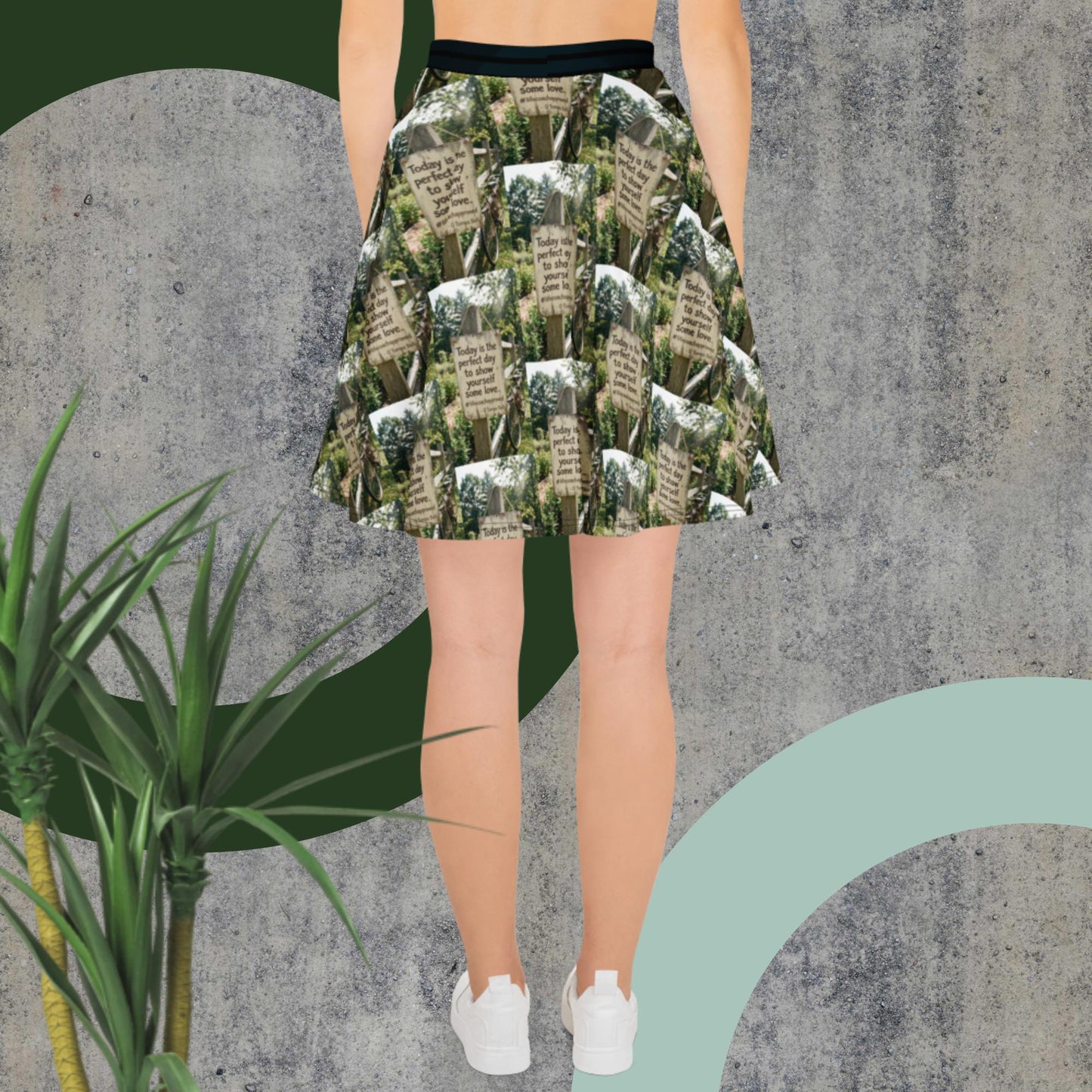 Green printed skater skirt with black waistband, full flare silhouette