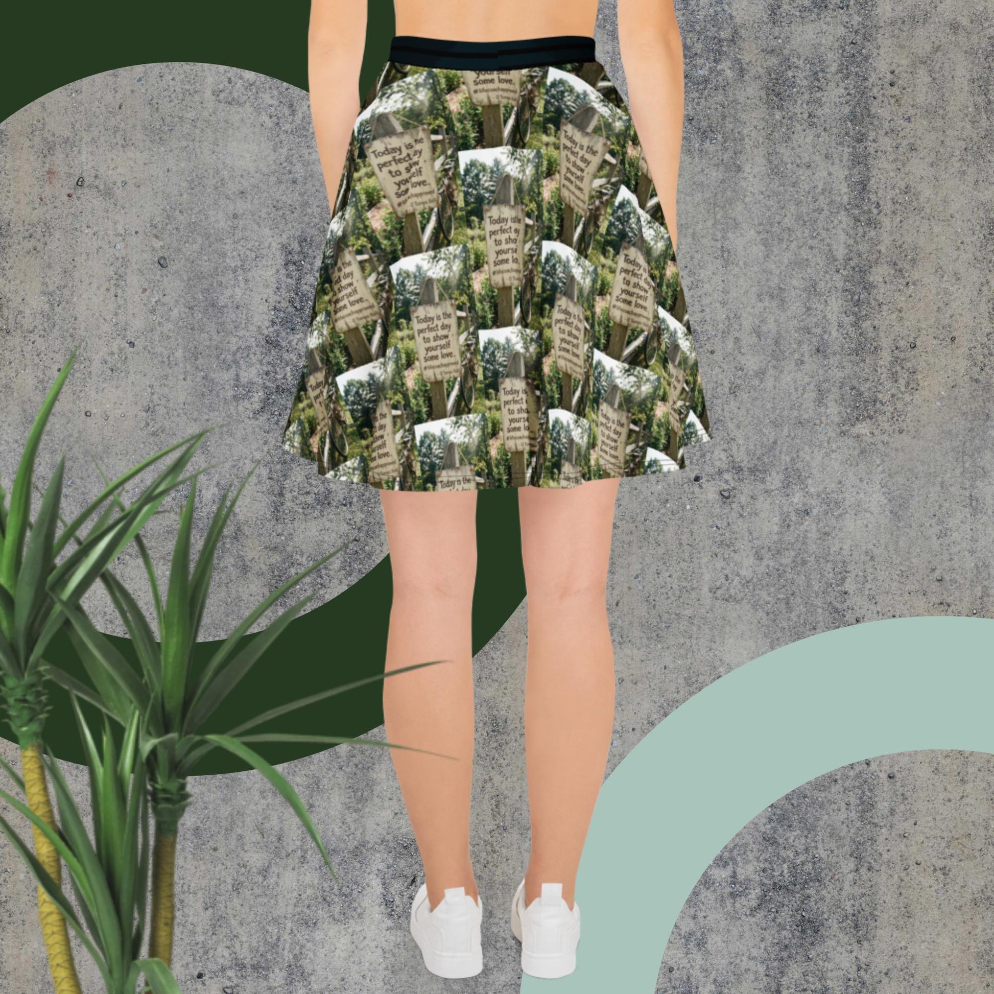 Green printed skater skirt with black waistband, full flare silhouette