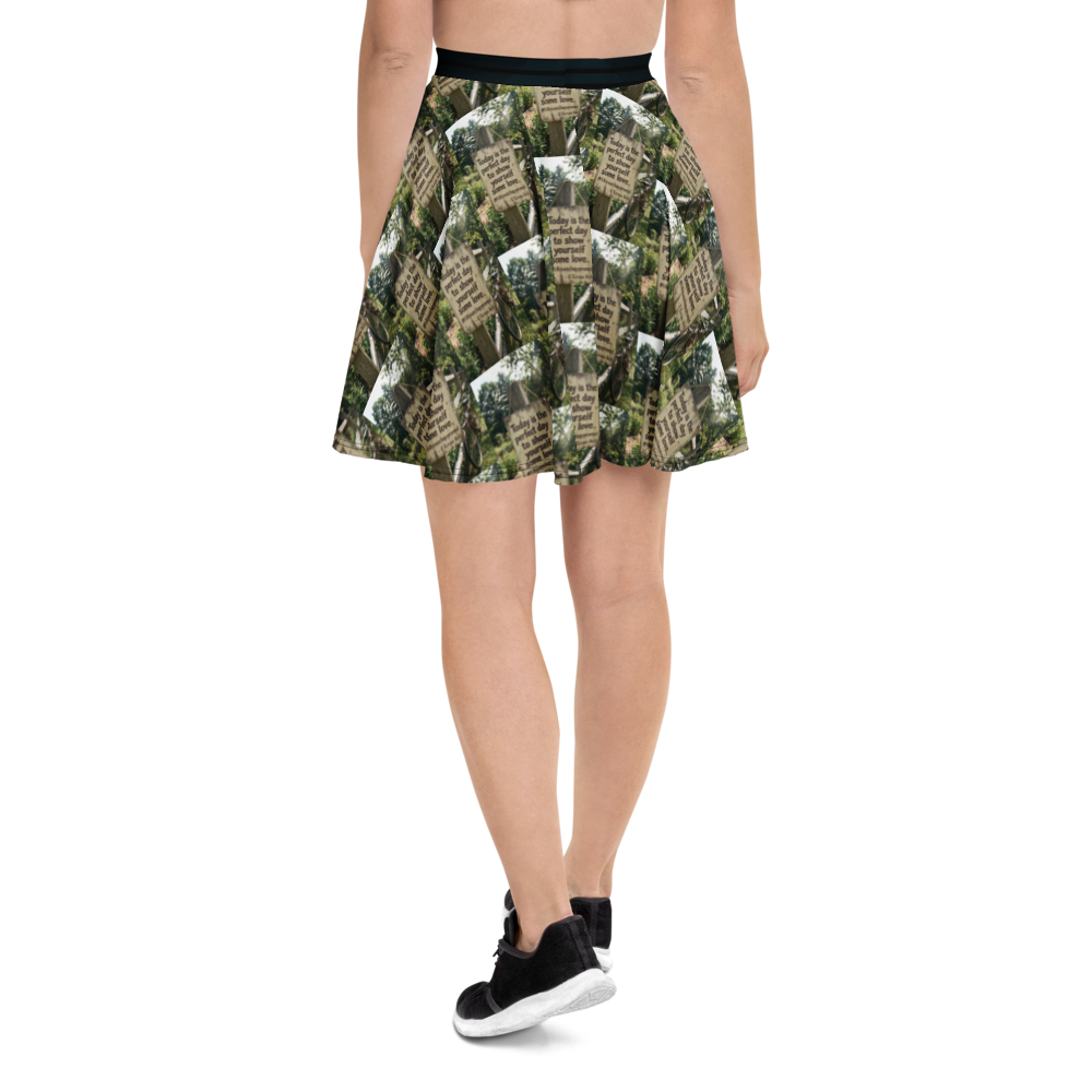 Green printed skater skirt with black waistband, short flared design