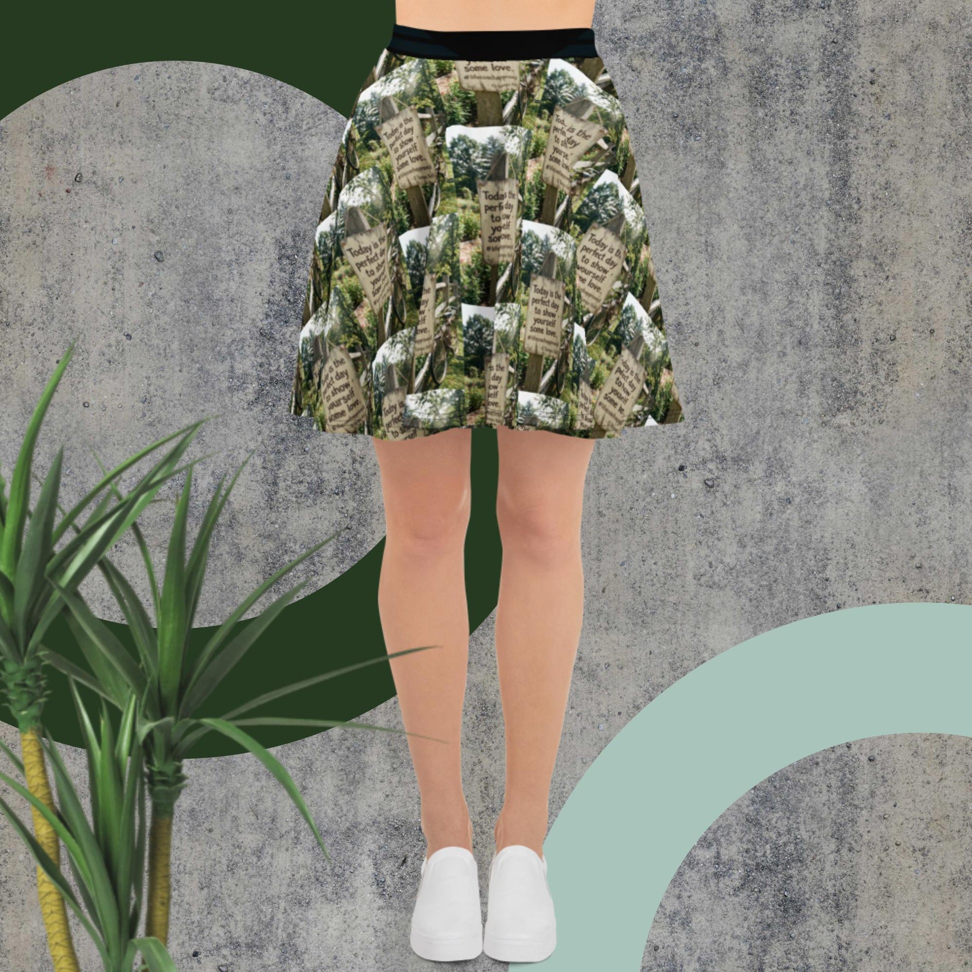 Green printed skater skirt with black waistband, above-knee length
