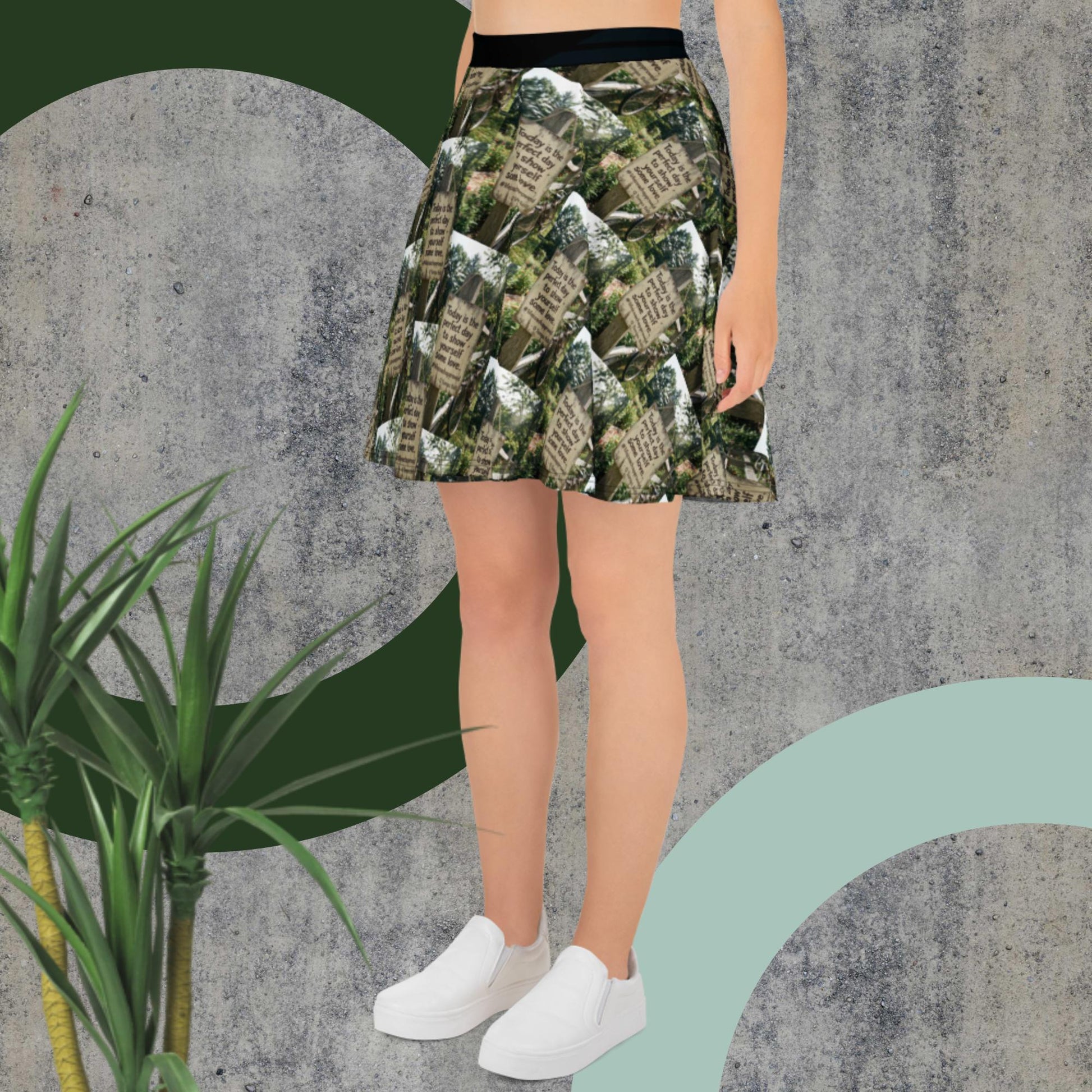 Green printed skater skirt with black waistband, flared above-knee cut