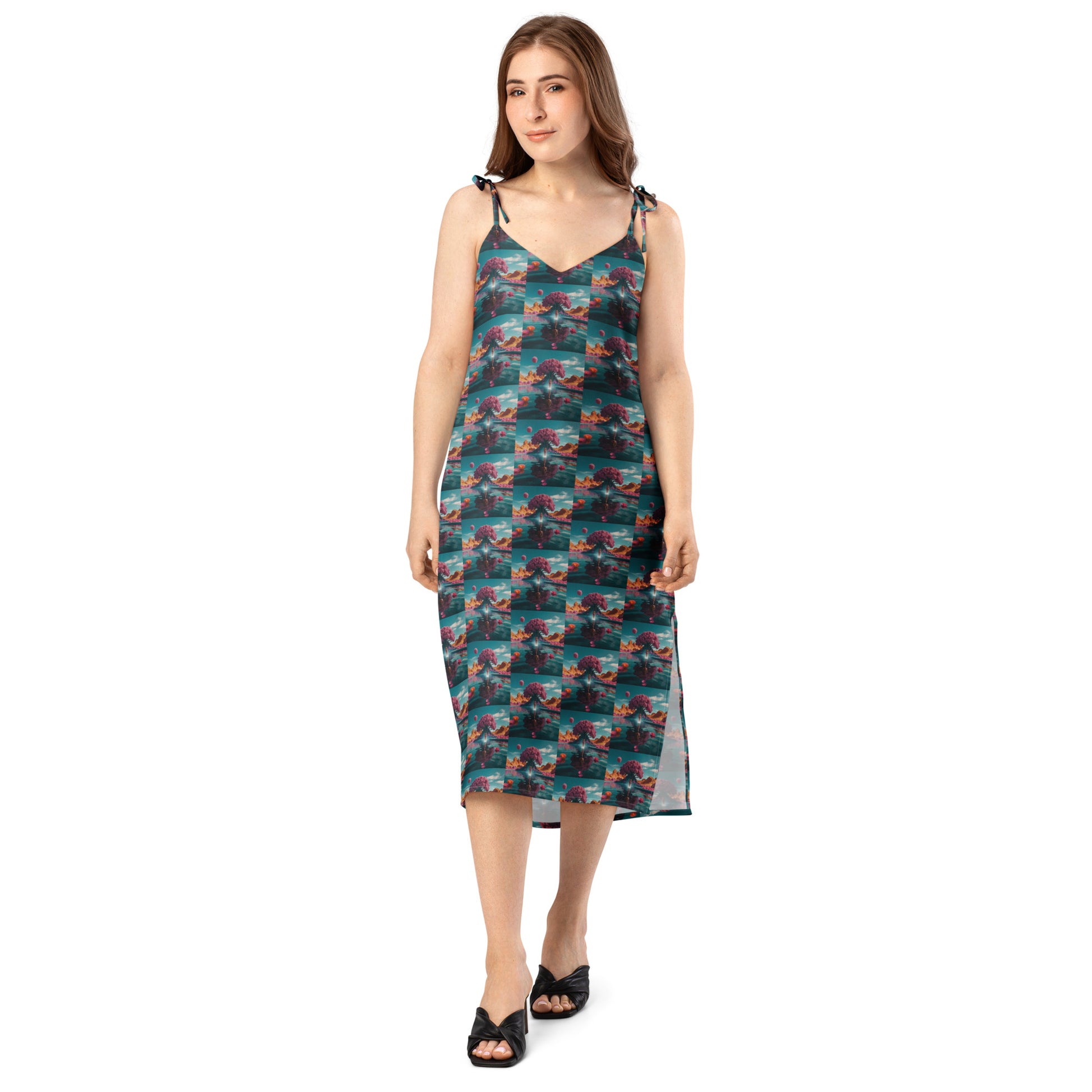 Teal tie-strap midi dress with V-neck and repeating ocean-themed pattern squares.