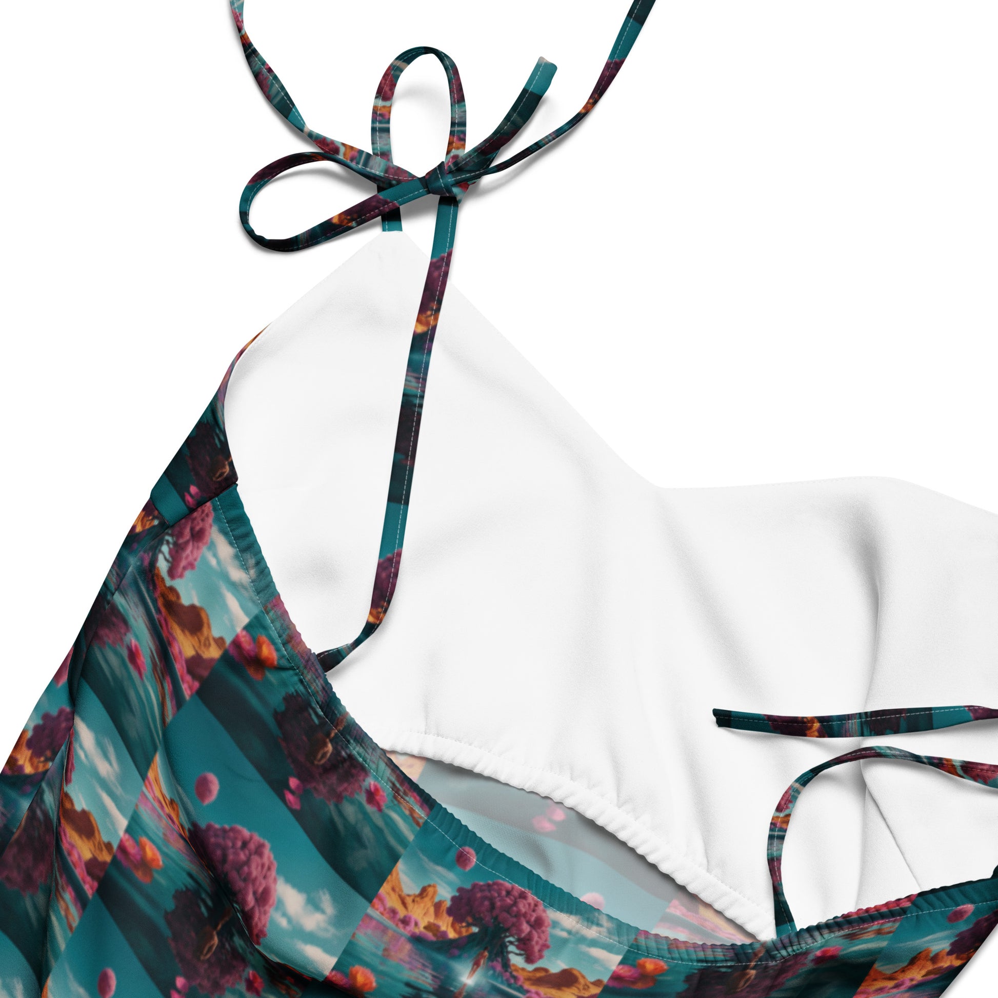 Close-up of tie-strap midi dress neckline with V-shaped seam and multicolor trim.