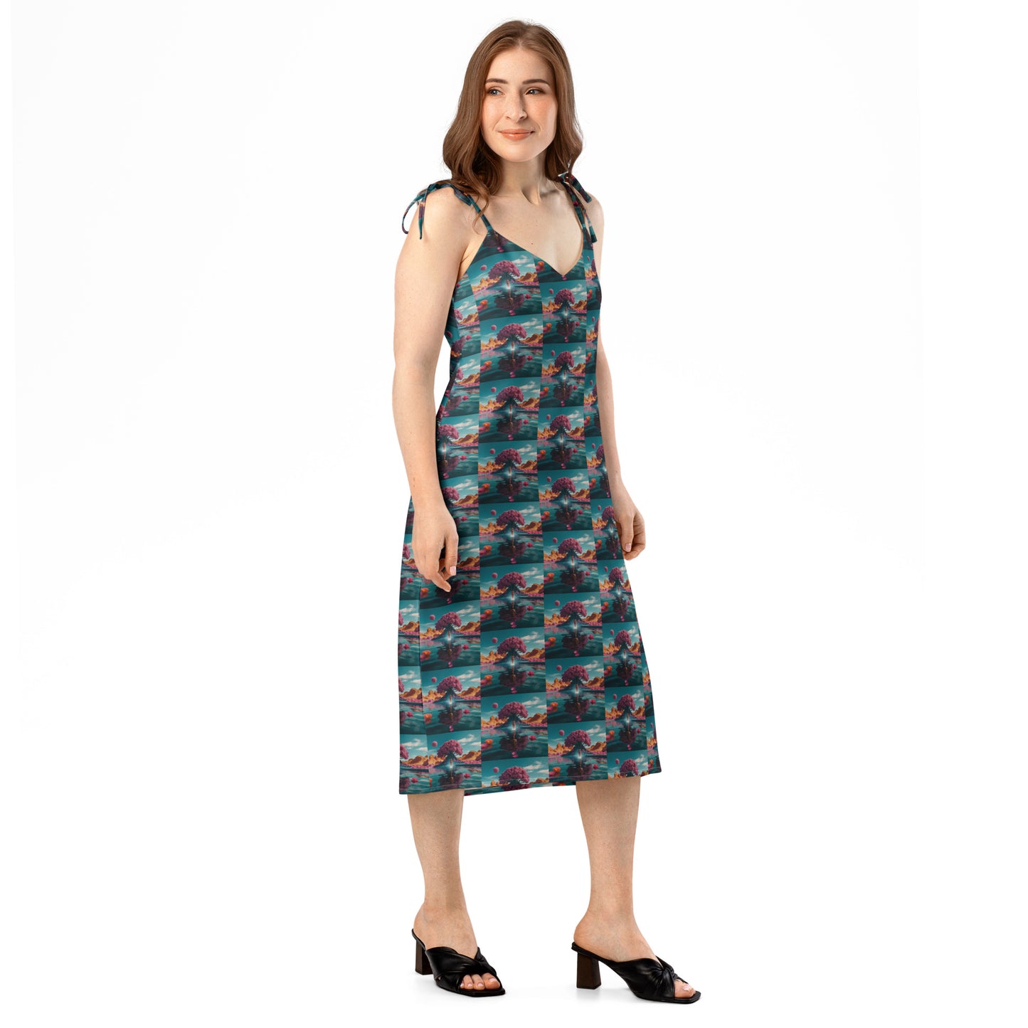 Teal ocean-print midi dress with thin tie straps, V-neck, and straight hem.
