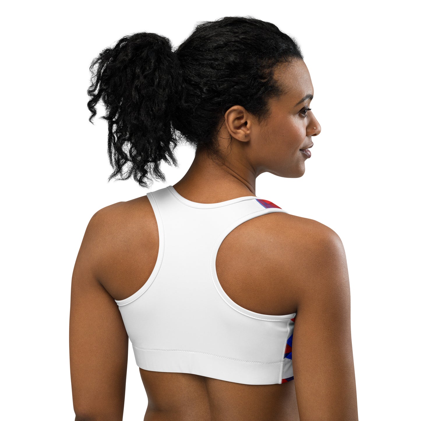 Back view sports bra in red and blue geometric print with white racerback straps