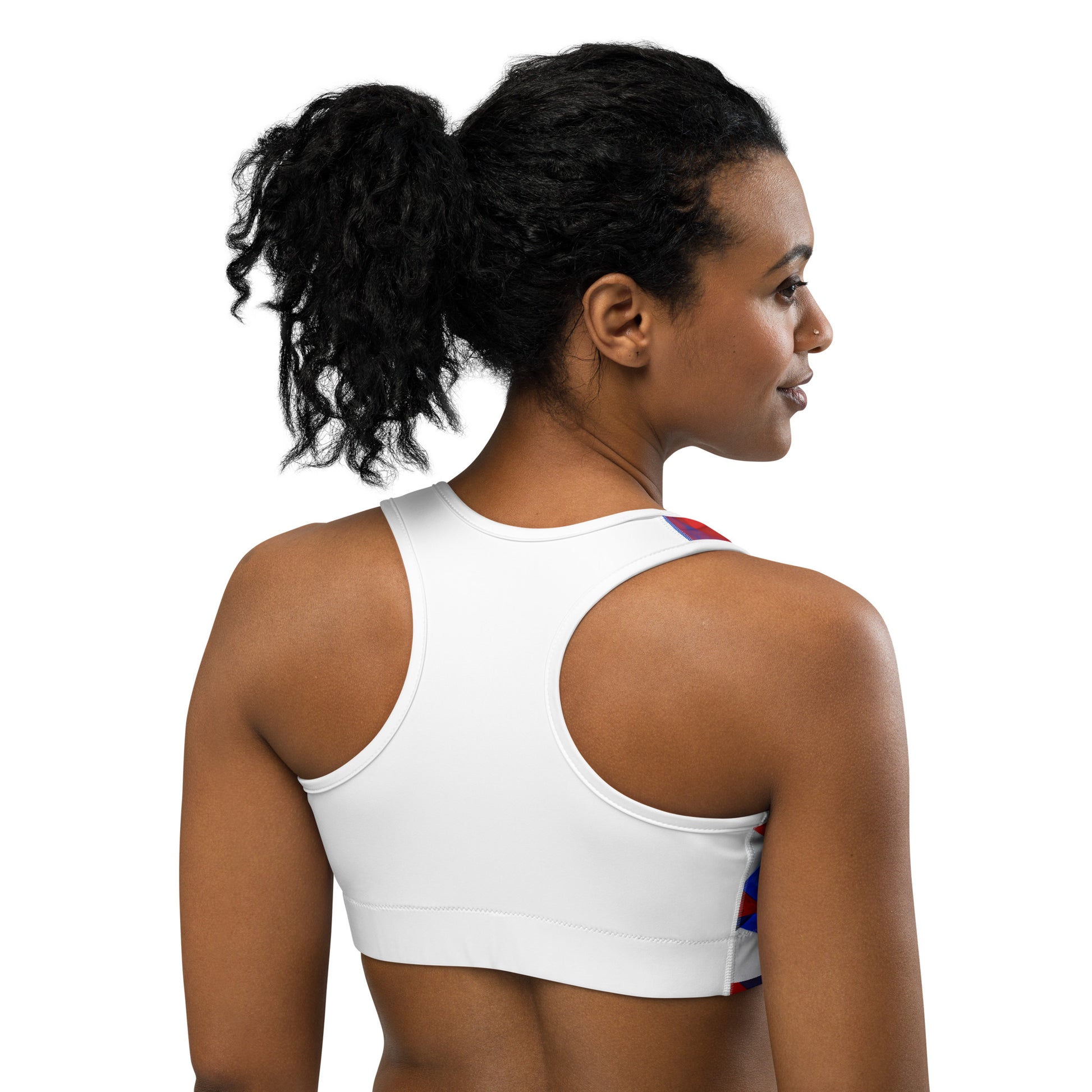 Back view sports bra in red and blue geometric print with white racerback straps