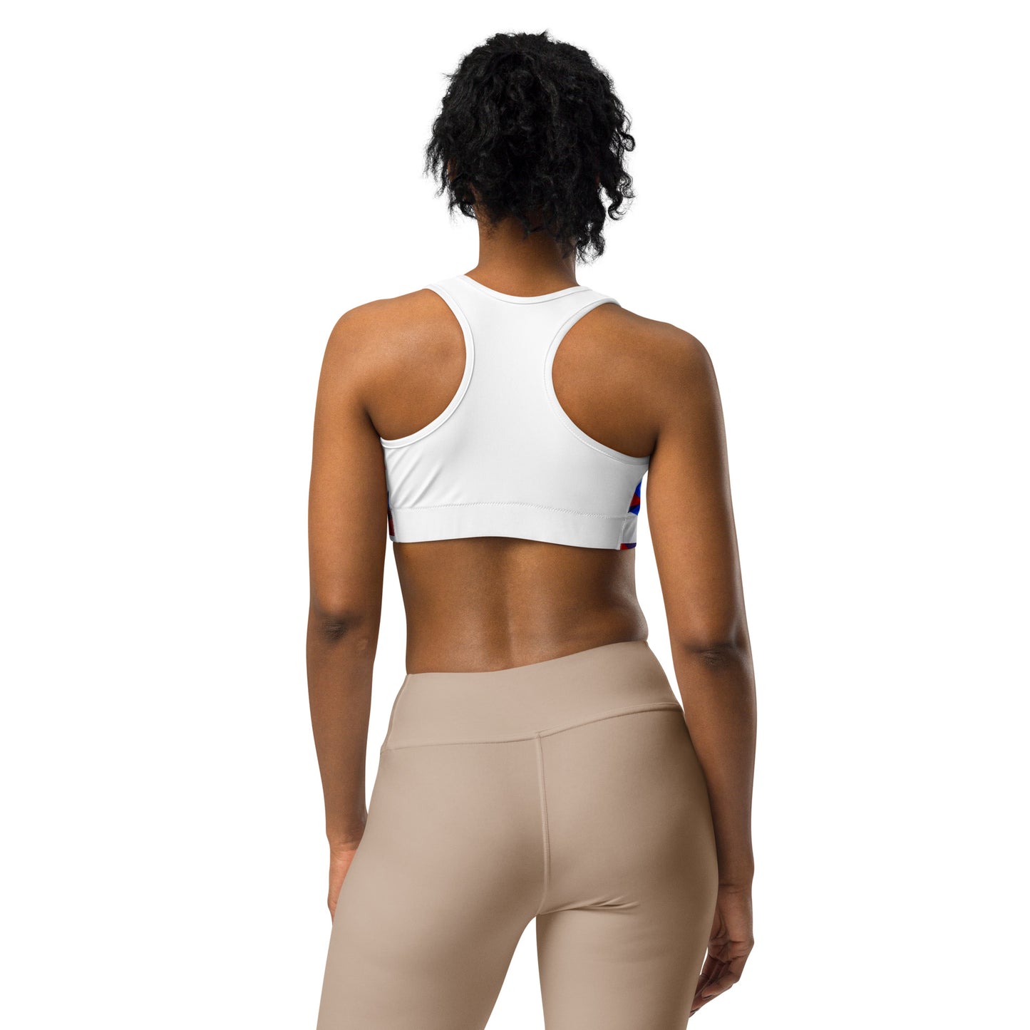Sports bra back view with white racerback design and red and blue geometric print