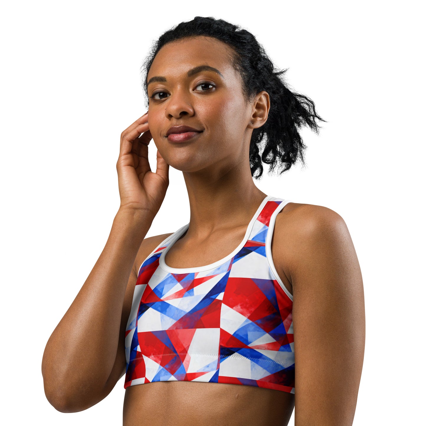 Front sports bra with red, white, and blue geometric print and wide white neckline