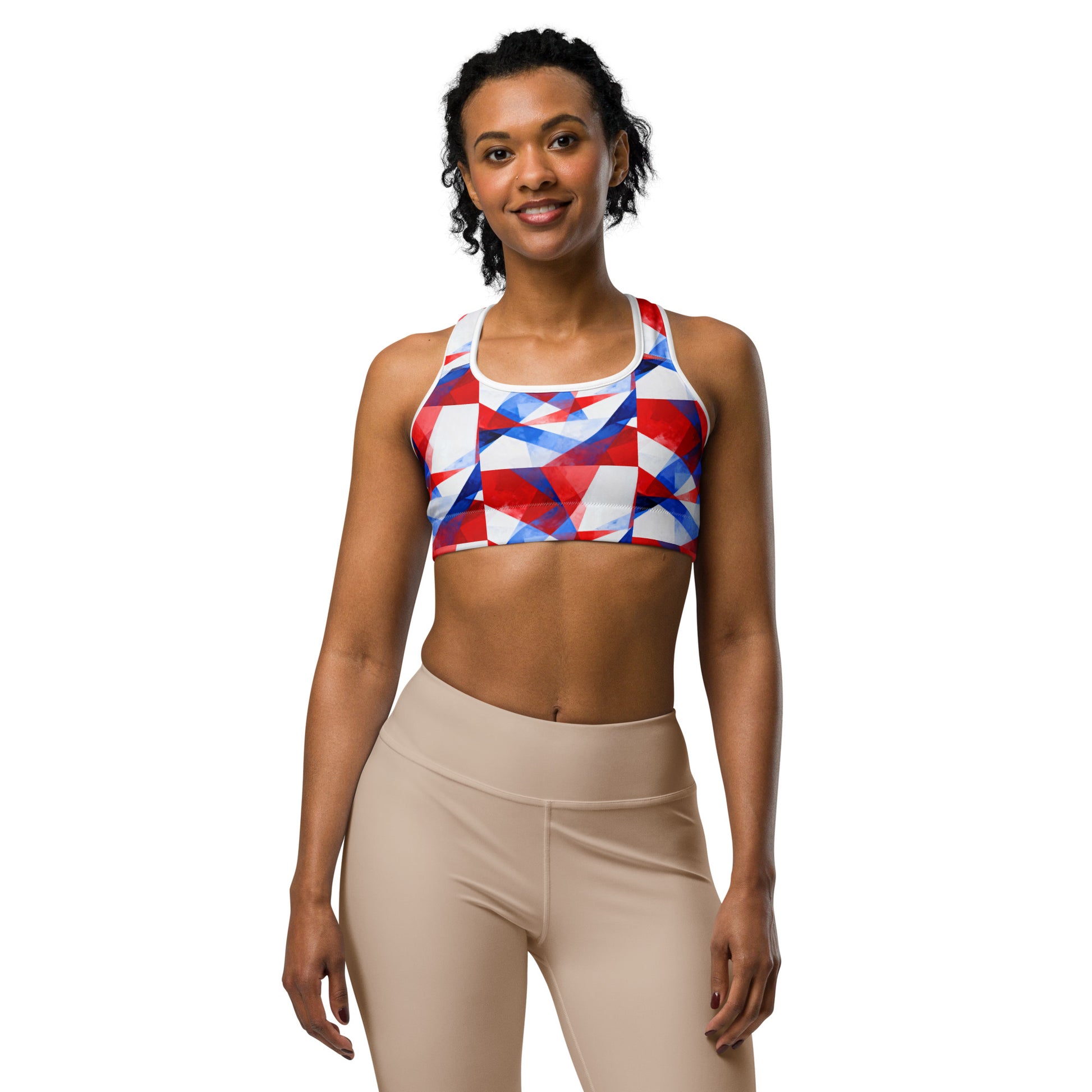 Sports bra with red, white, and blue geometric print and white racerback straps