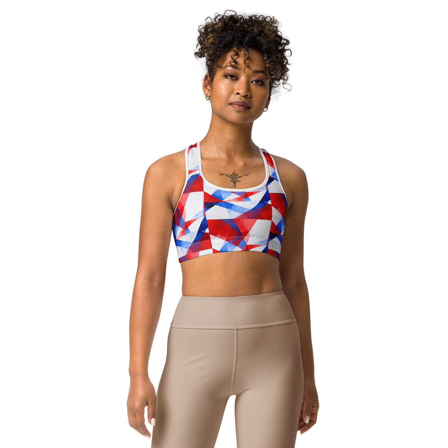 Front view sports bra with red, white, and blue geometric print and scoop neckline
