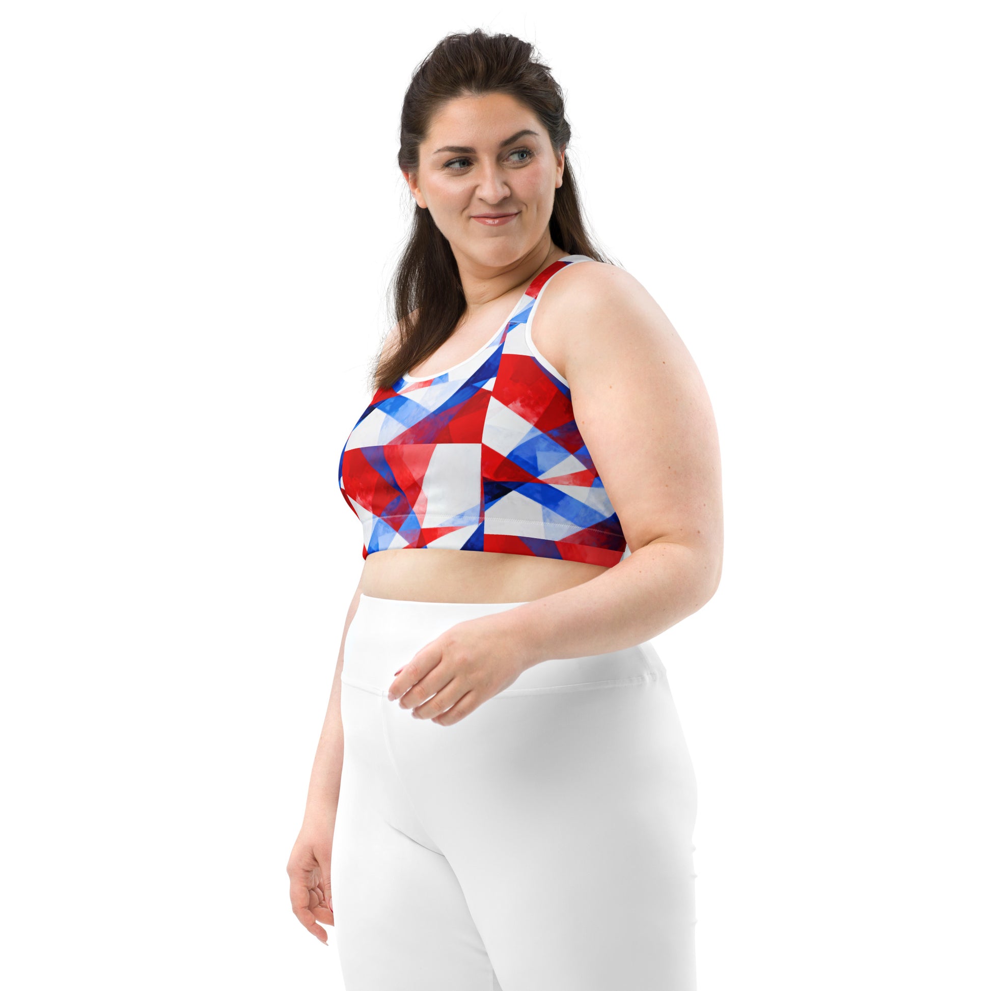 Front-left sports bra with red and blue geometric print and white racerback straps