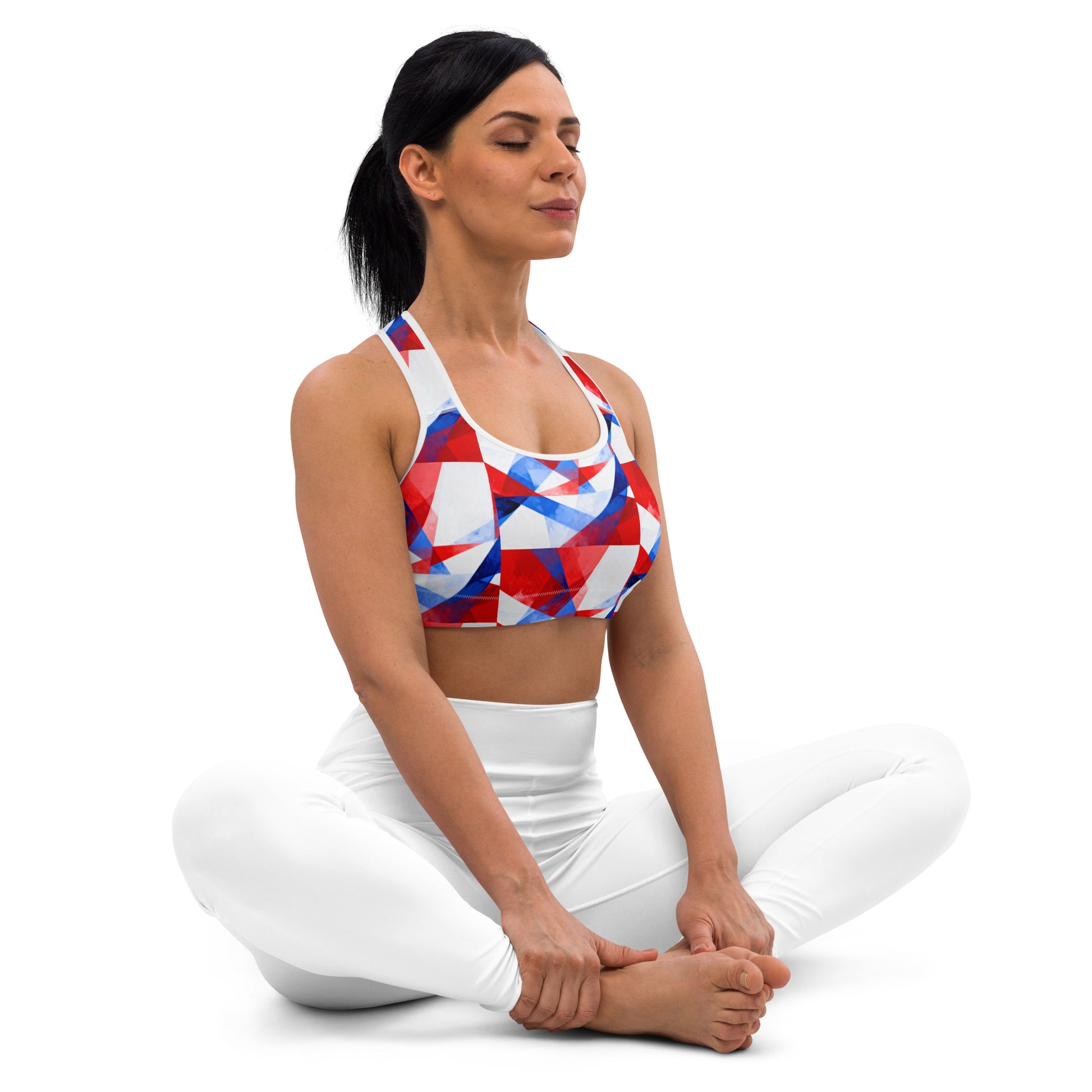 Sports bra with red, white, and blue geometric print; scoop front neckline