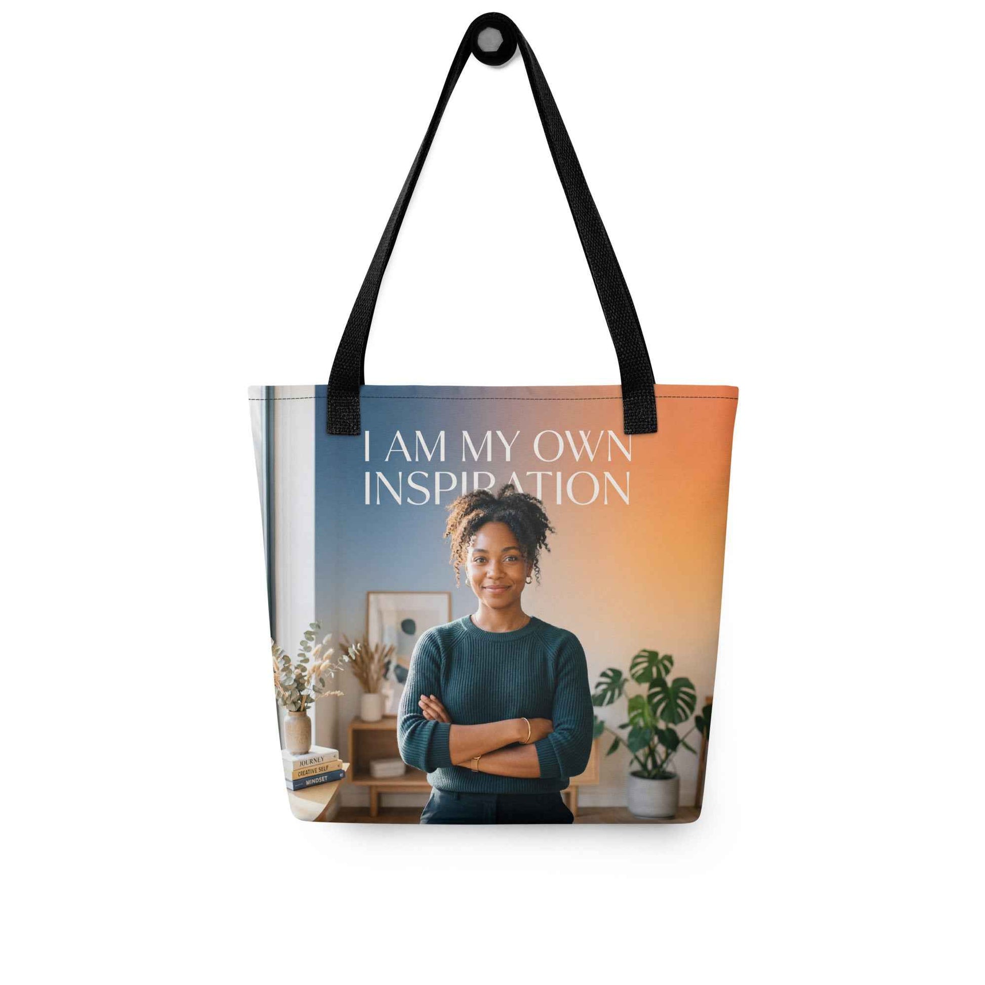 Printed tote bag with black handles; “I AM MY OWN INSPIRATION” text over portrait image.