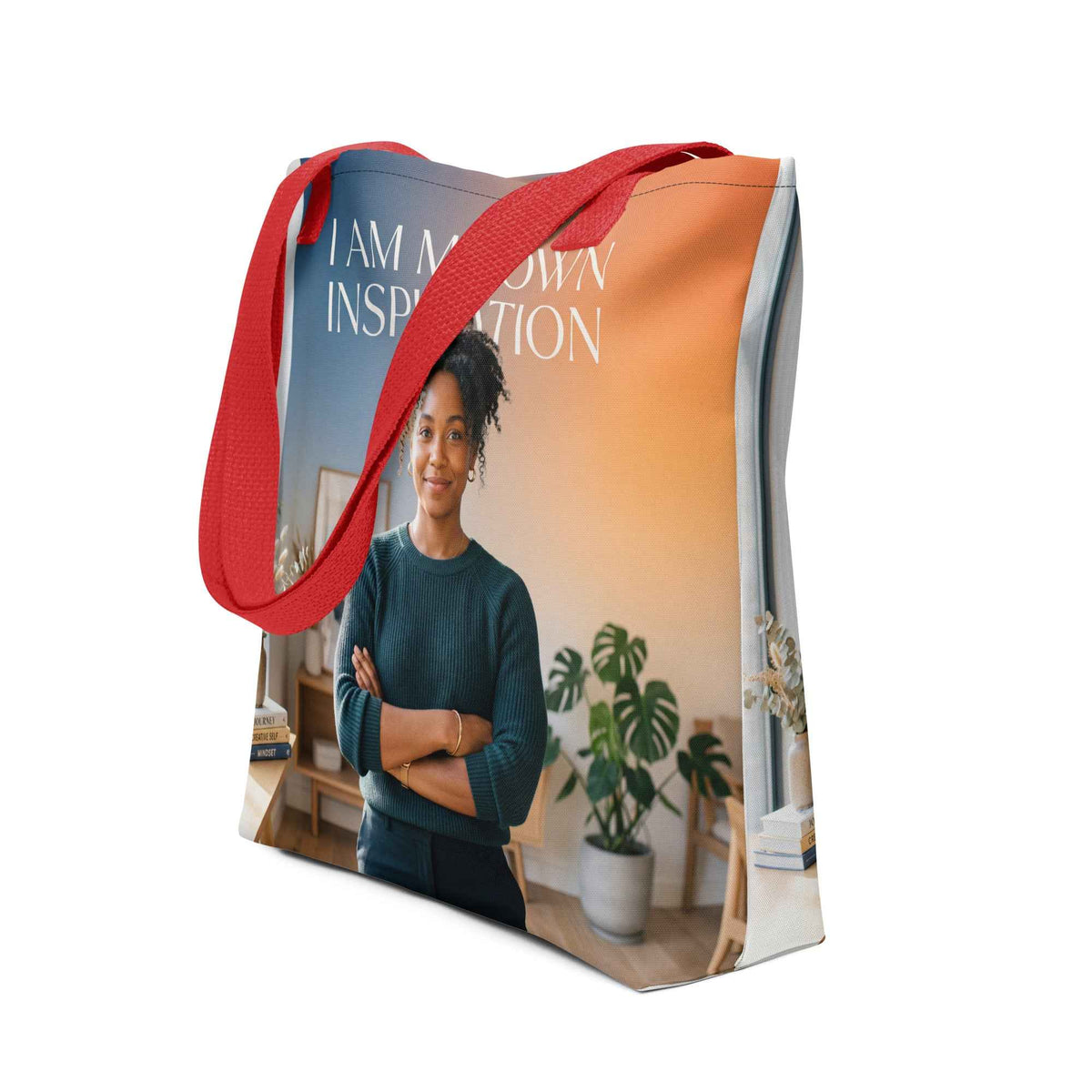Canvas tote bag with red handles and front print reading "I AM MY OWN INSPIRATION".