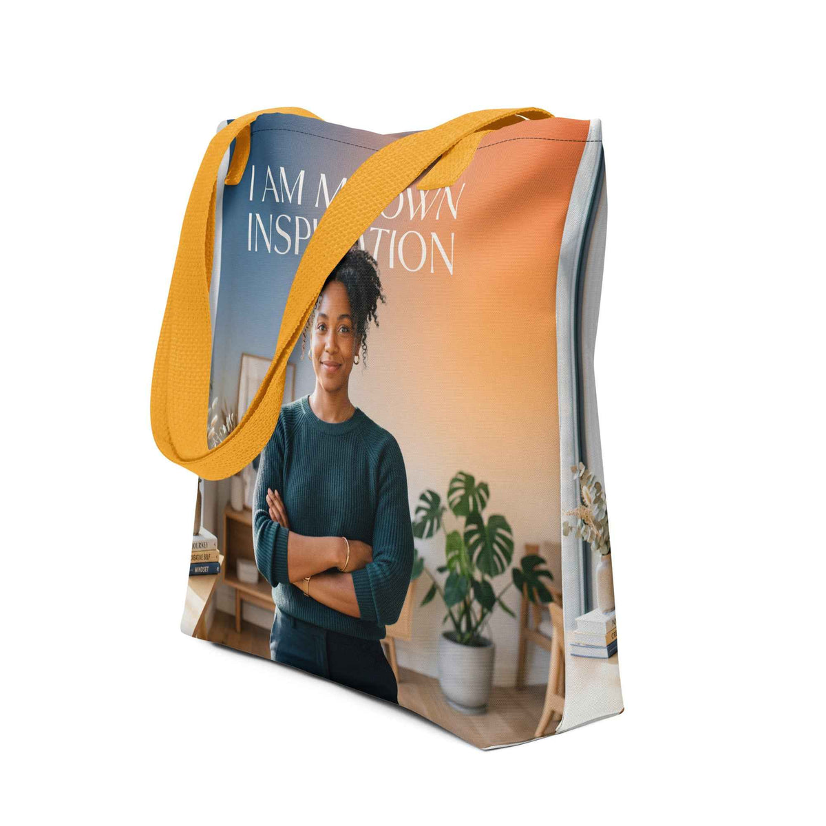 Canvas tote bag with yellow handles and front print reading "I AM MY OWN INSPIRATION".