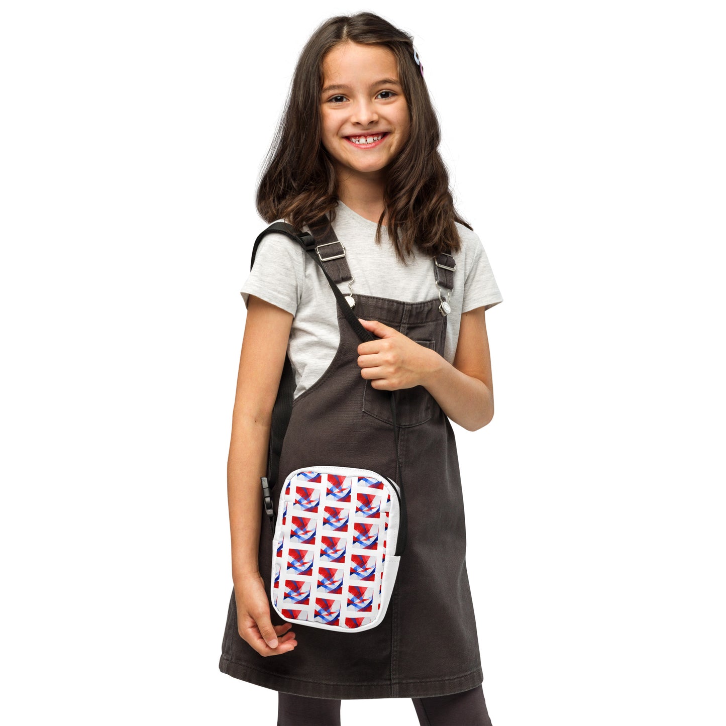 Utility crossbody bag with white UK flag pattern and black straps, worn over shoulder on front view.