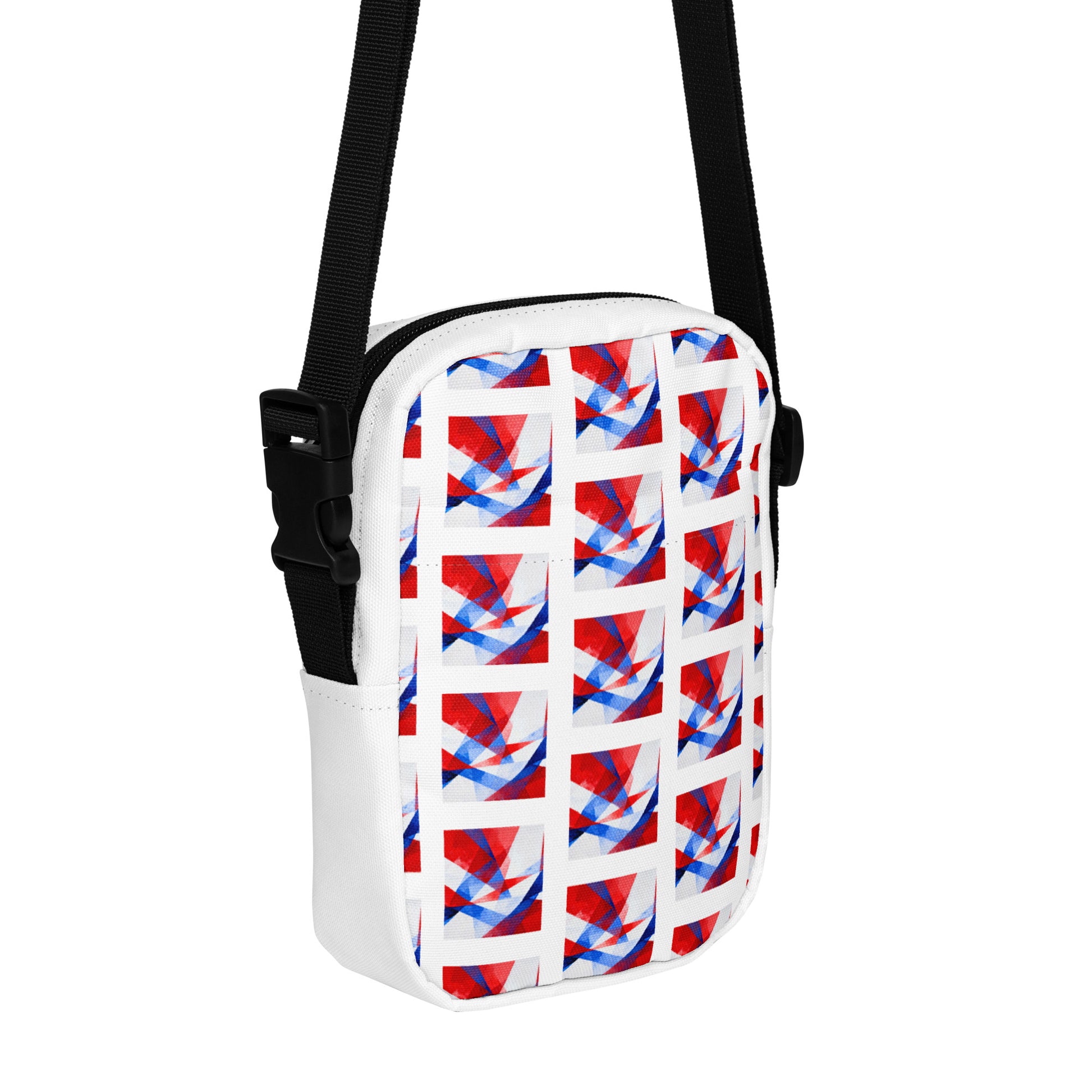 Utility crossbody bag with black strap, patterned front pocket and curved top edge