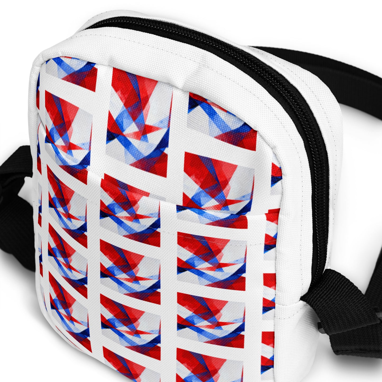 Utility crossbody bag front detail: white panel with geometric Union Jack pattern