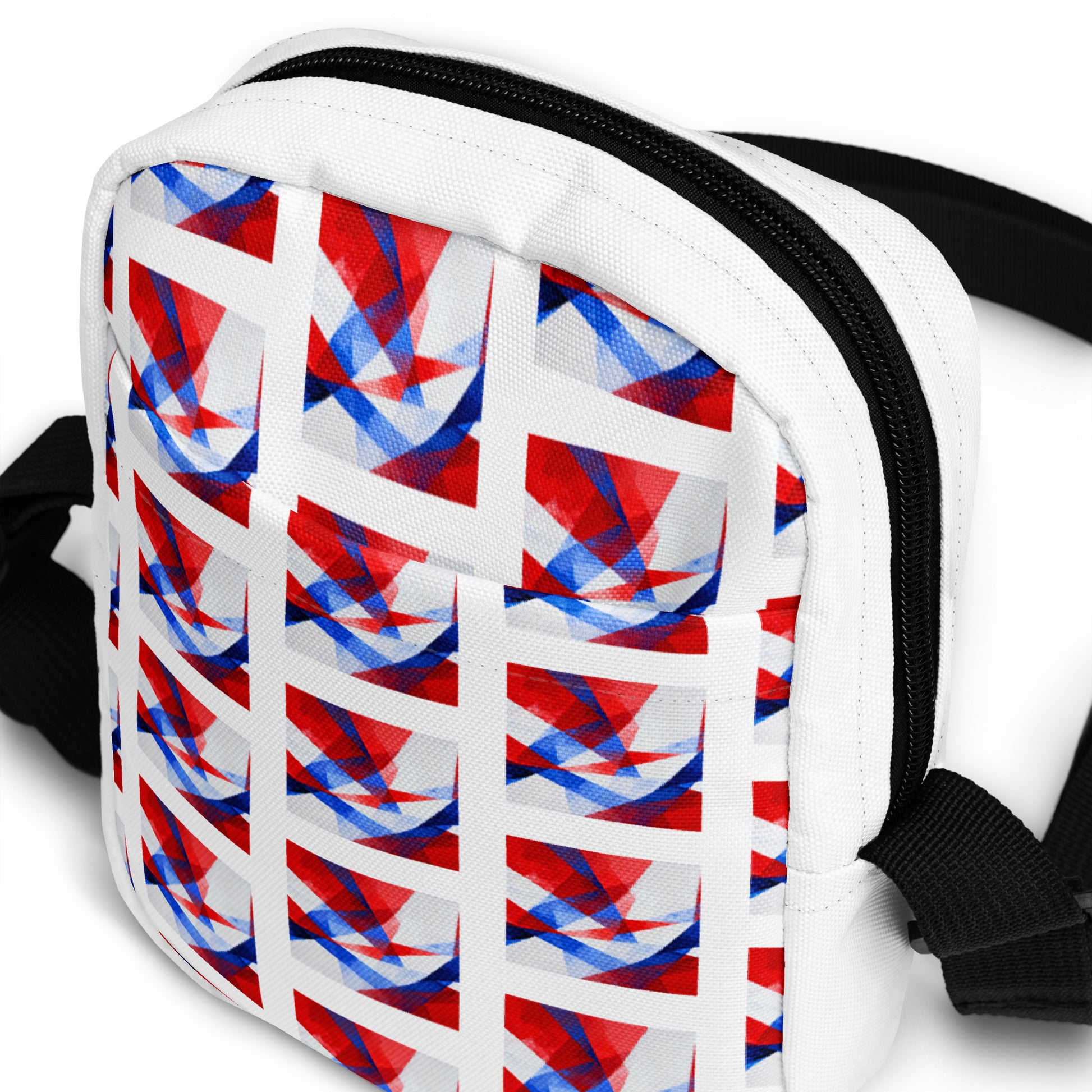 Utility crossbody bag front detail: white panel with geometric Union Jack pattern
