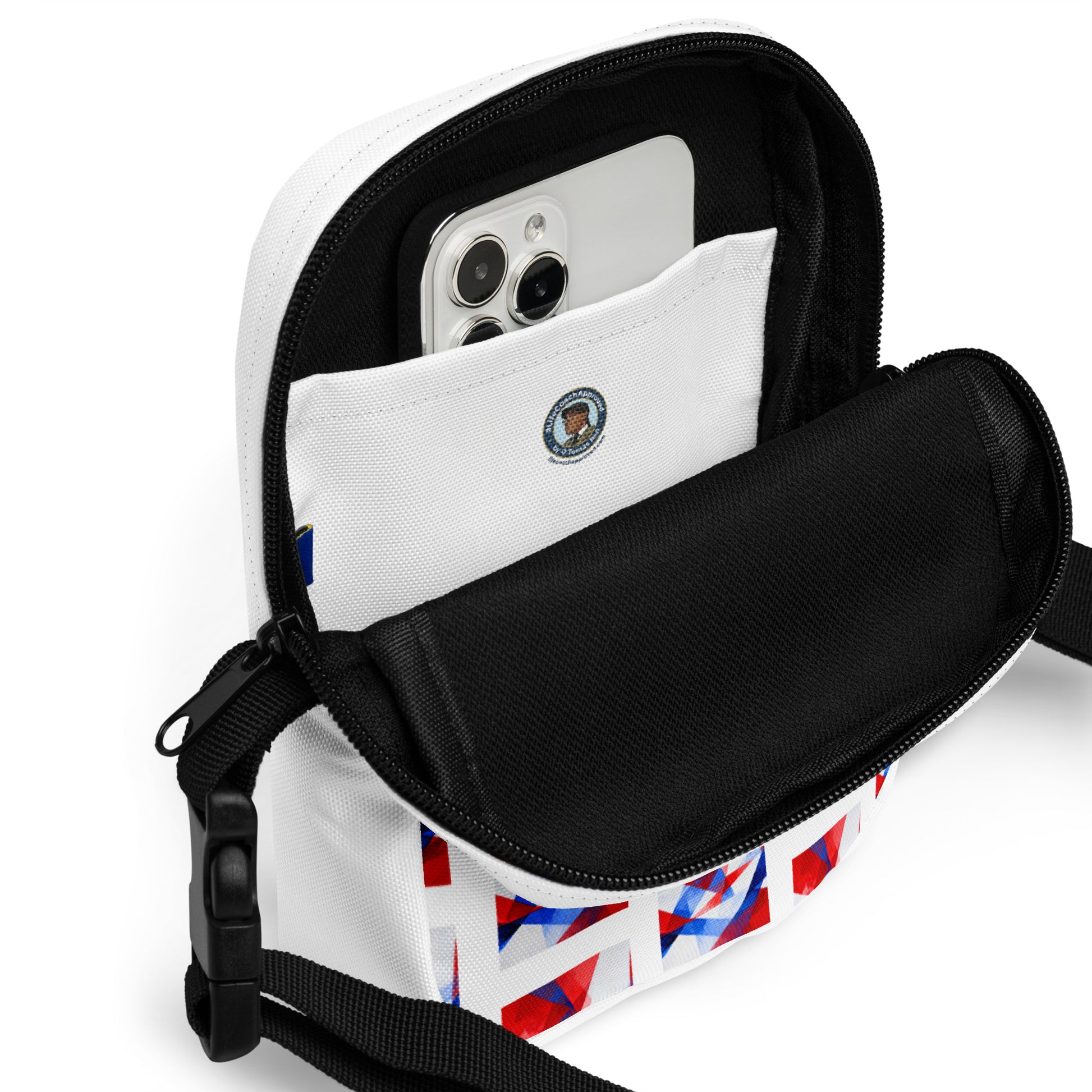Utility crossbody bag open with black interior lining and phone-size pocket; visible zipper top.
