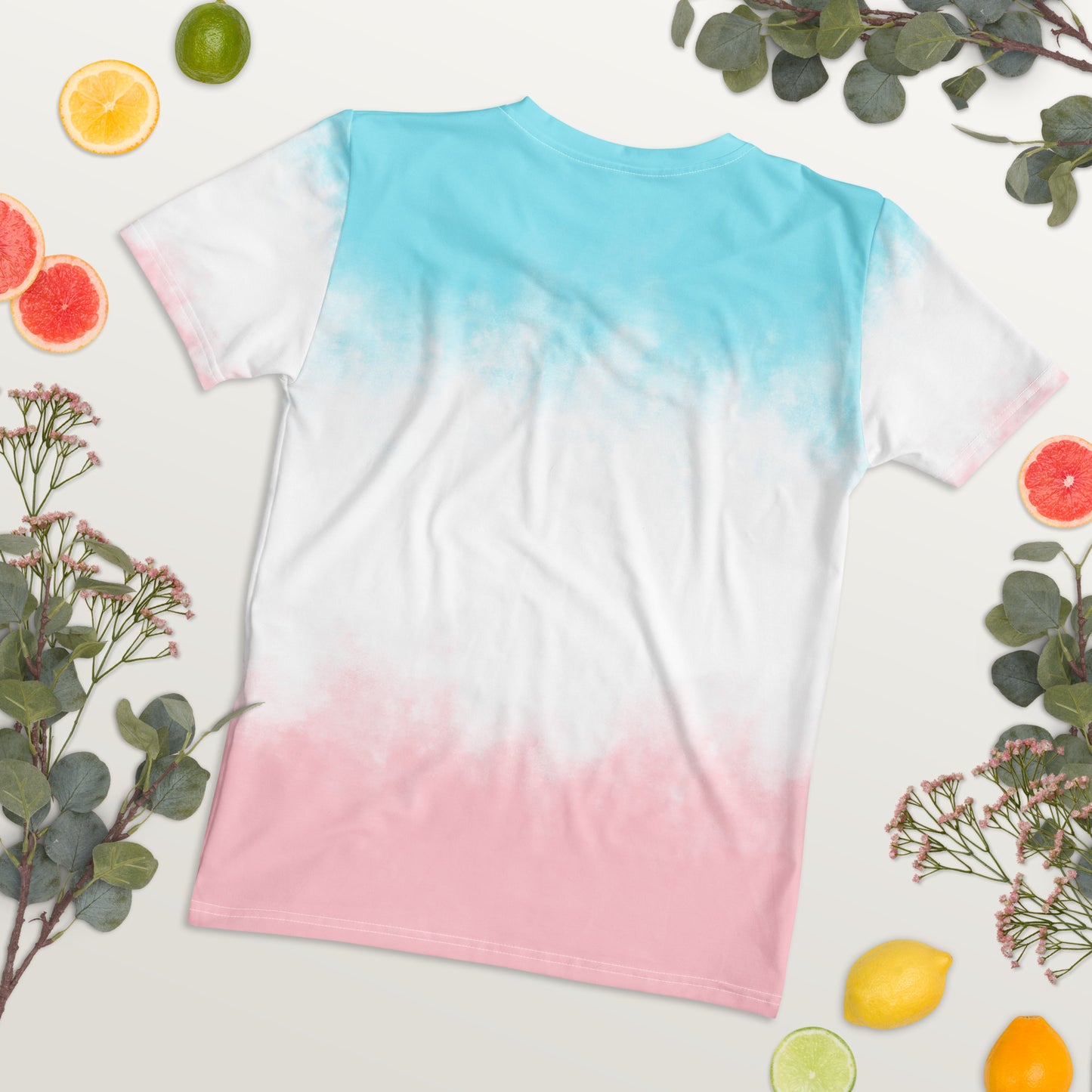Women’s tie-dye t-shirt, back view: aqua top with white center, pink hem.