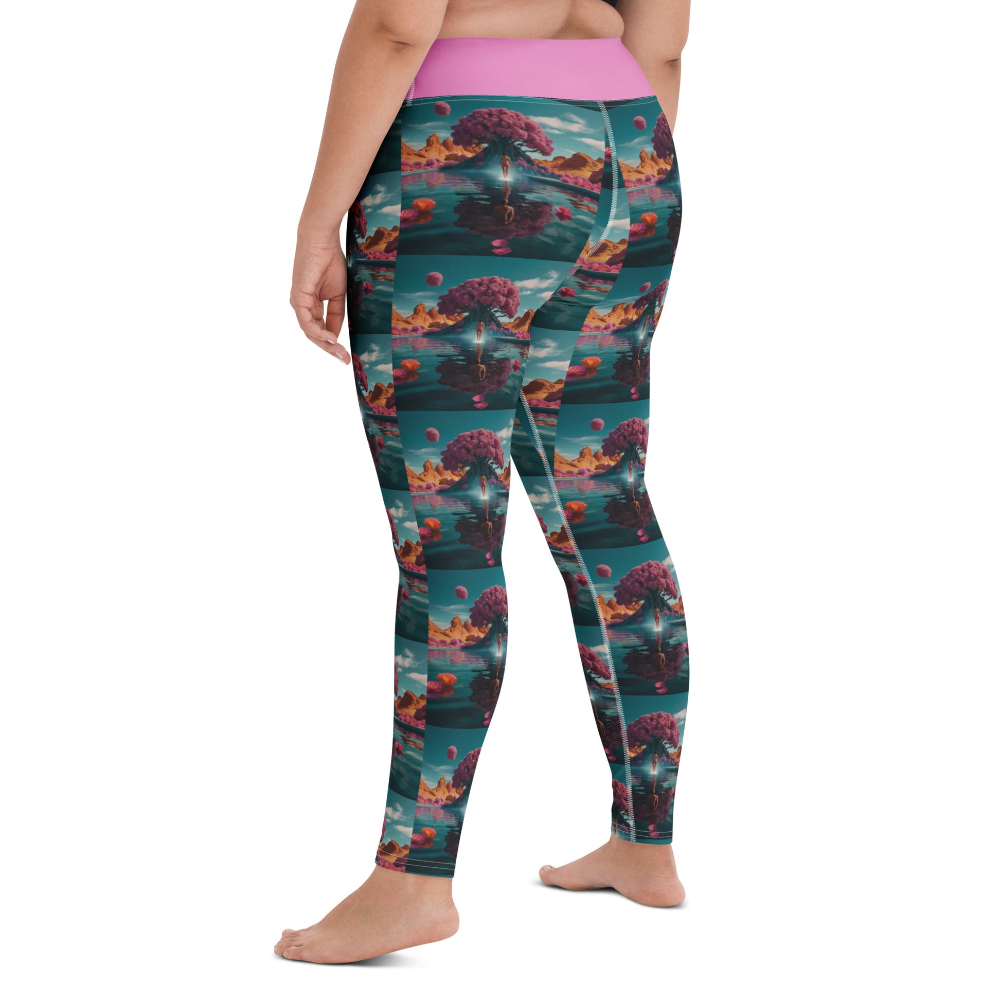 Teal yoga leggings with pink waistband and scenic landscape print, side view