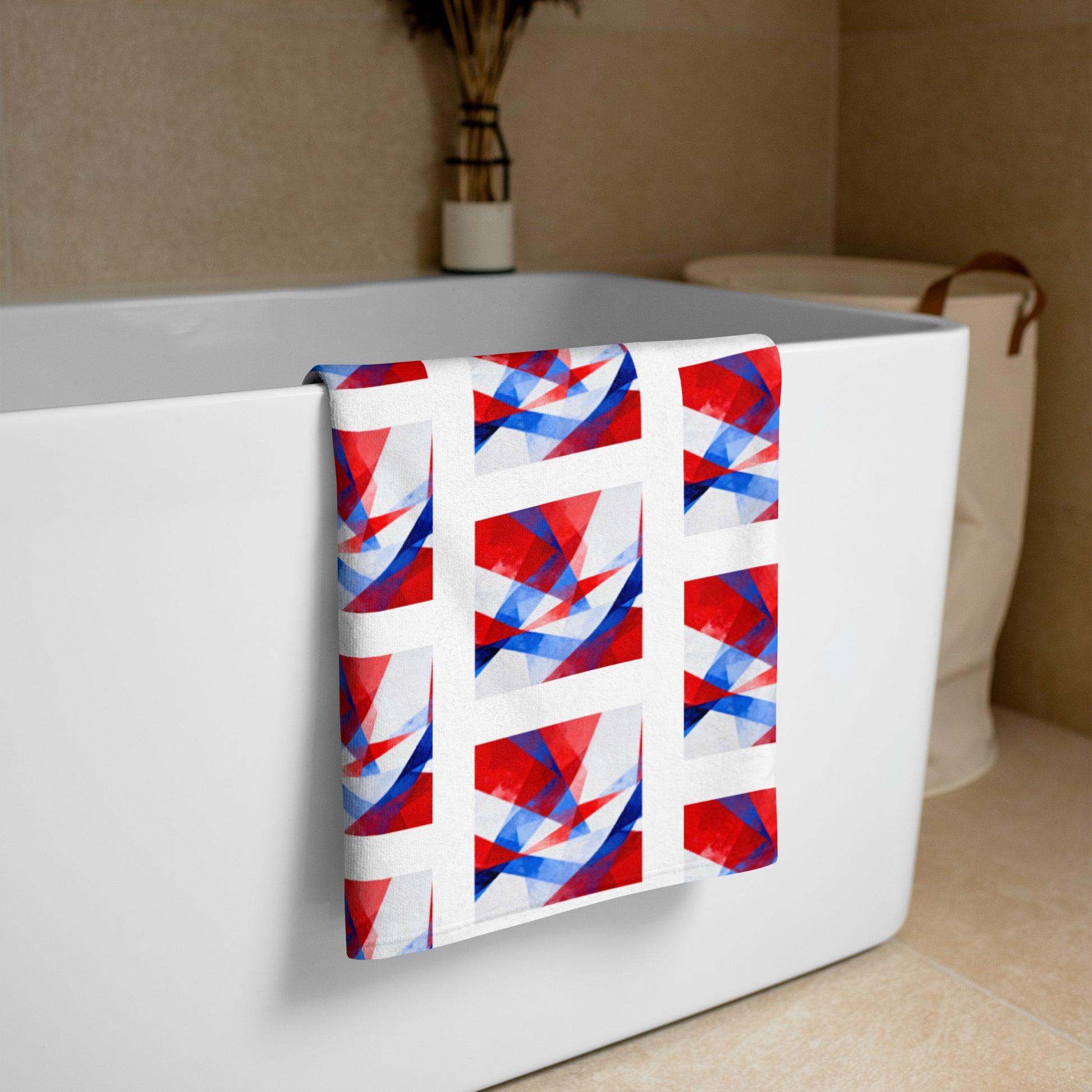 Beach towel draped over a container edge, with a white base and red-blue Union Jack pattern.