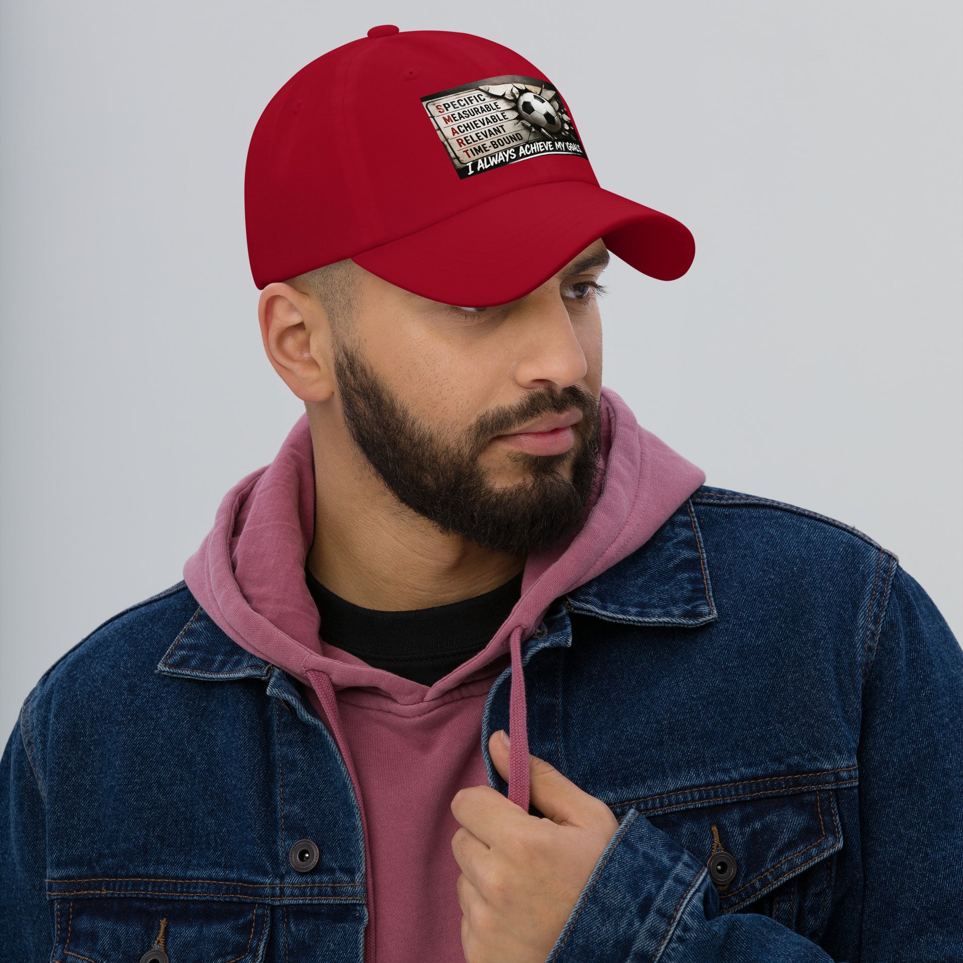 Red dad hat with curved brim and front patch graphic