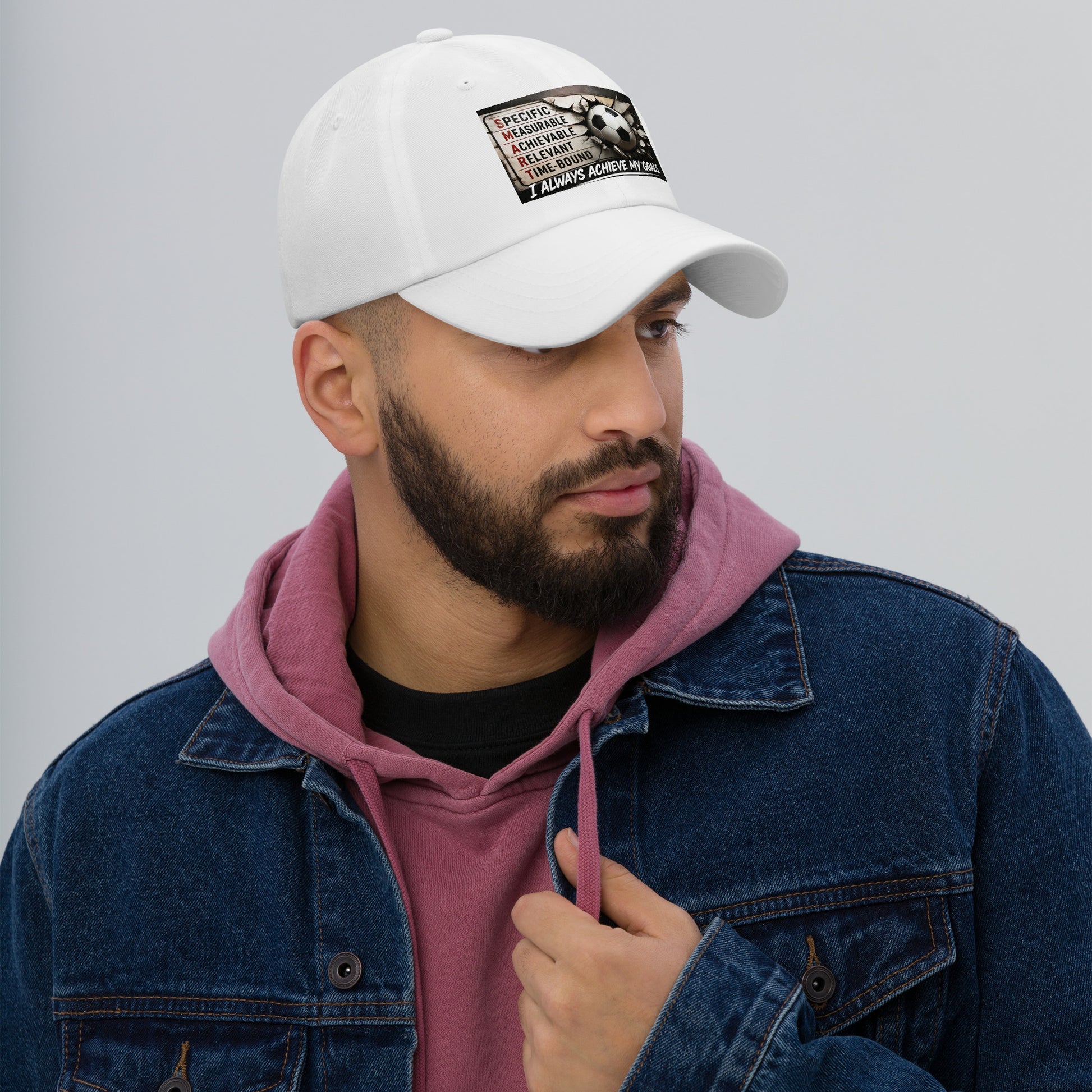 White dad hat with stitched front logo patch, curved brim and adjustable strap