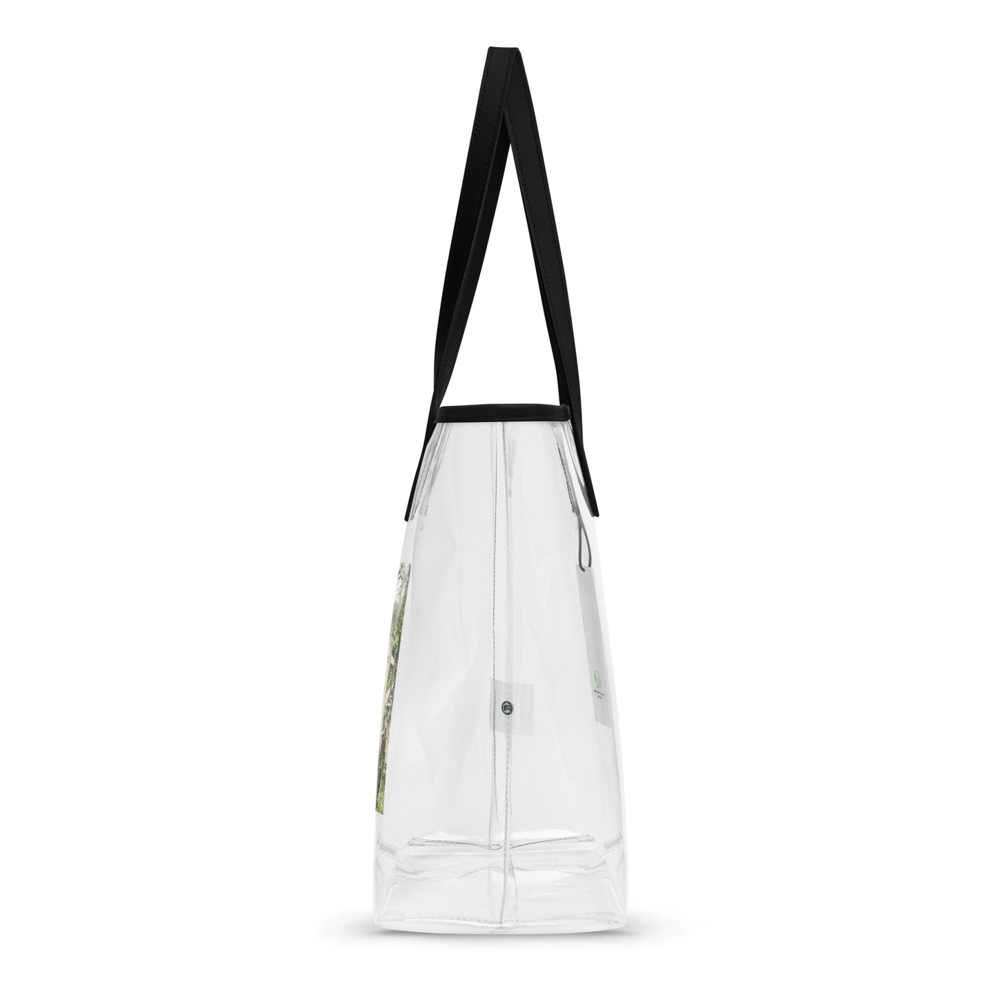 Clear tote bag with black handles, side view with visible stitched panels