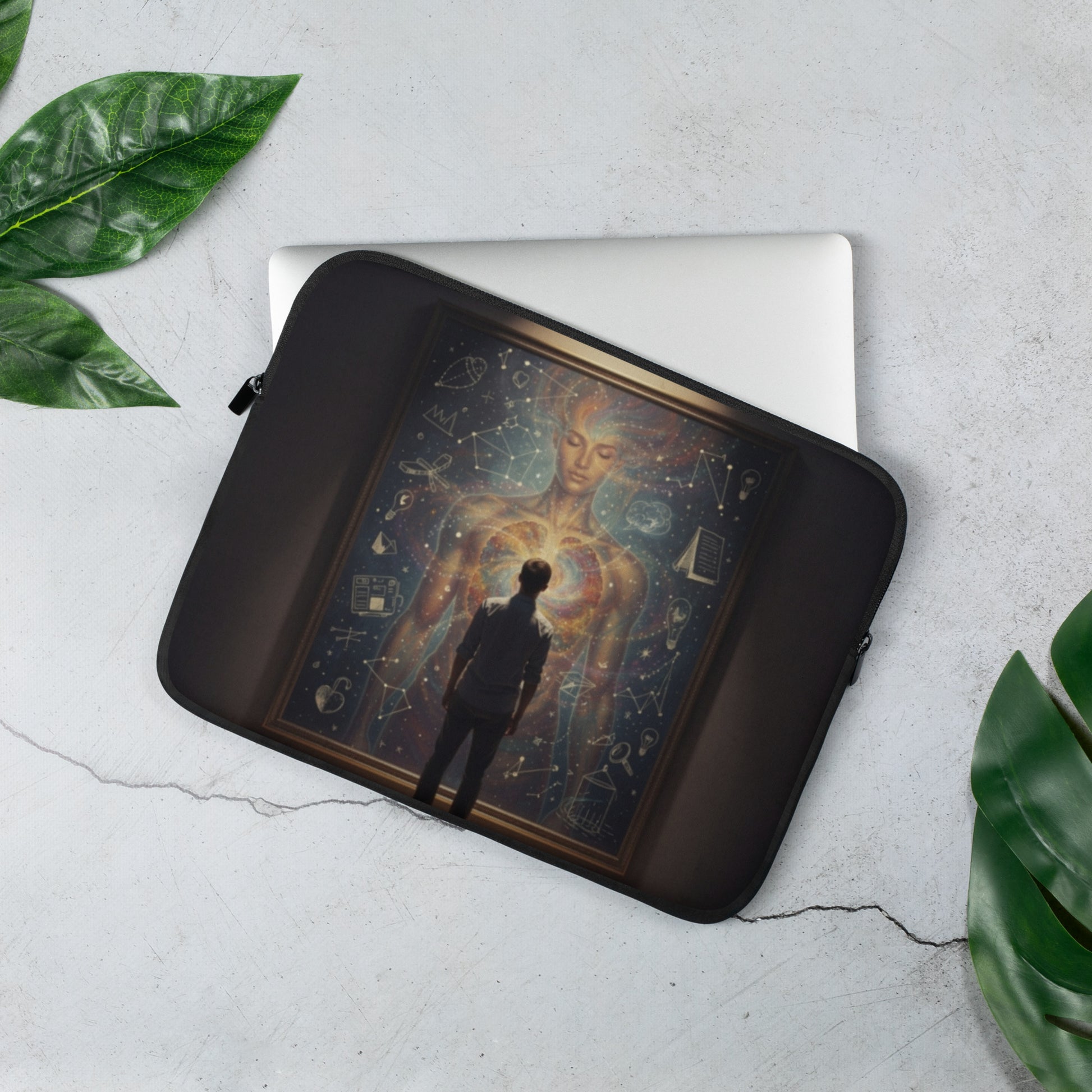 Black laptop sleeve open to hold a light-colored laptop with celestial artwork
