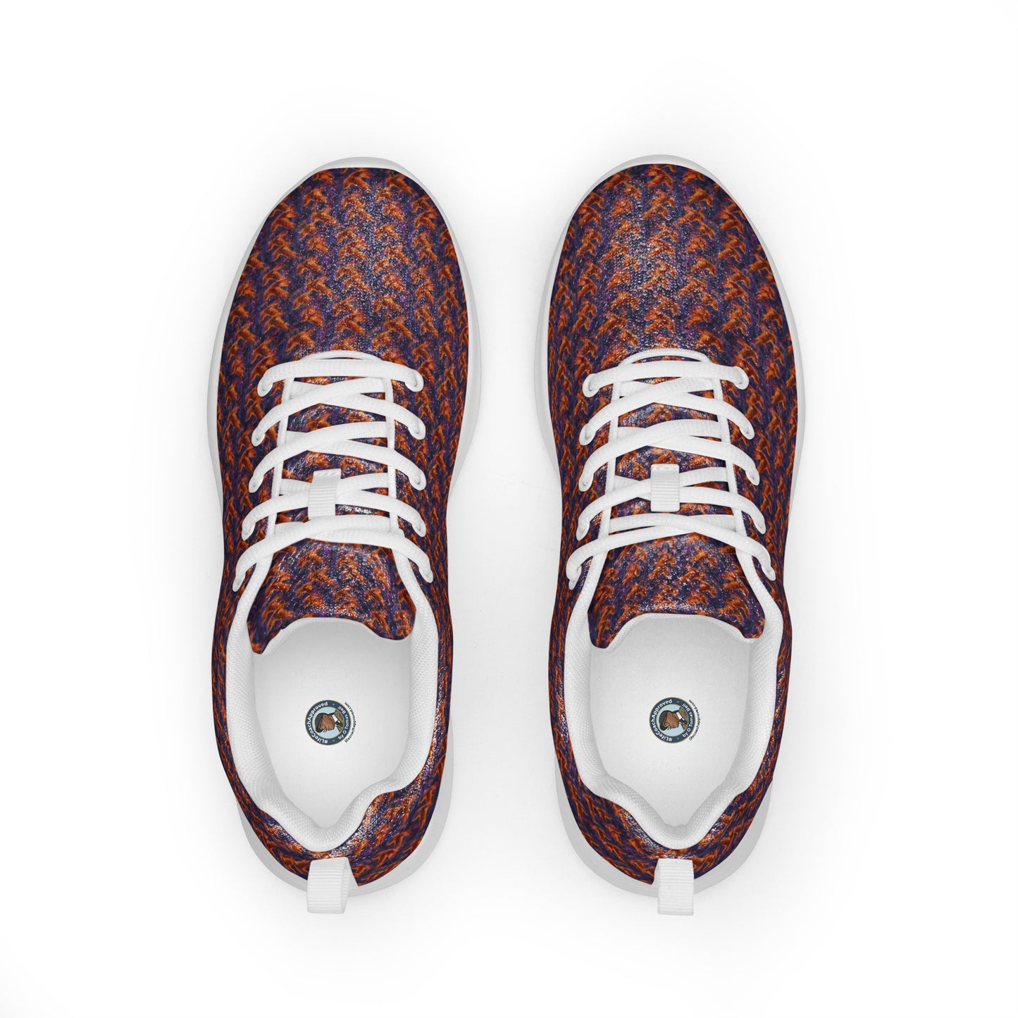 Athletic shoes top view with orange-and-blue textured knit, white laces and rounded toe