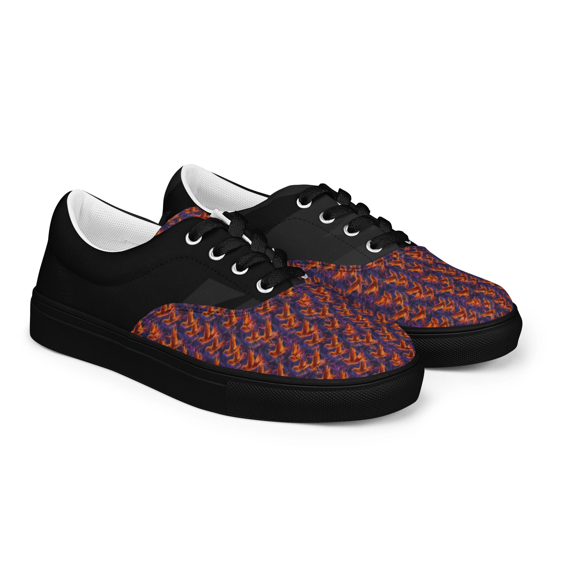 Side view of black lace-up sneakers with flame-pattern canvas uppers
