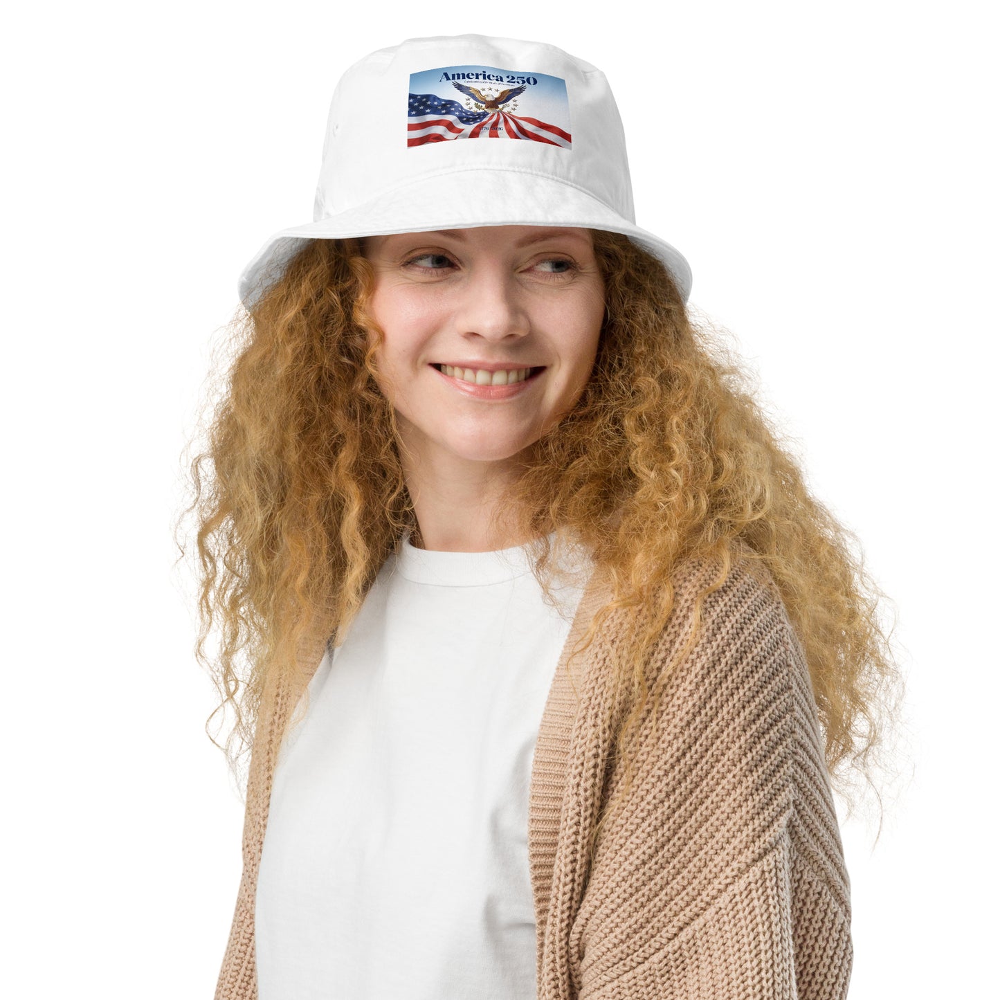 White organic bucket hat with America-themed front patch and wide brim.