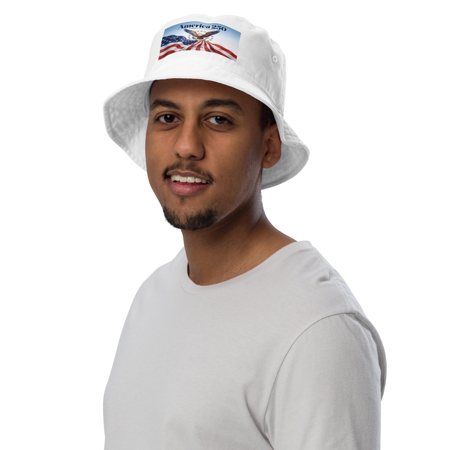 White bucket hat with front America-themed patch on a male model.