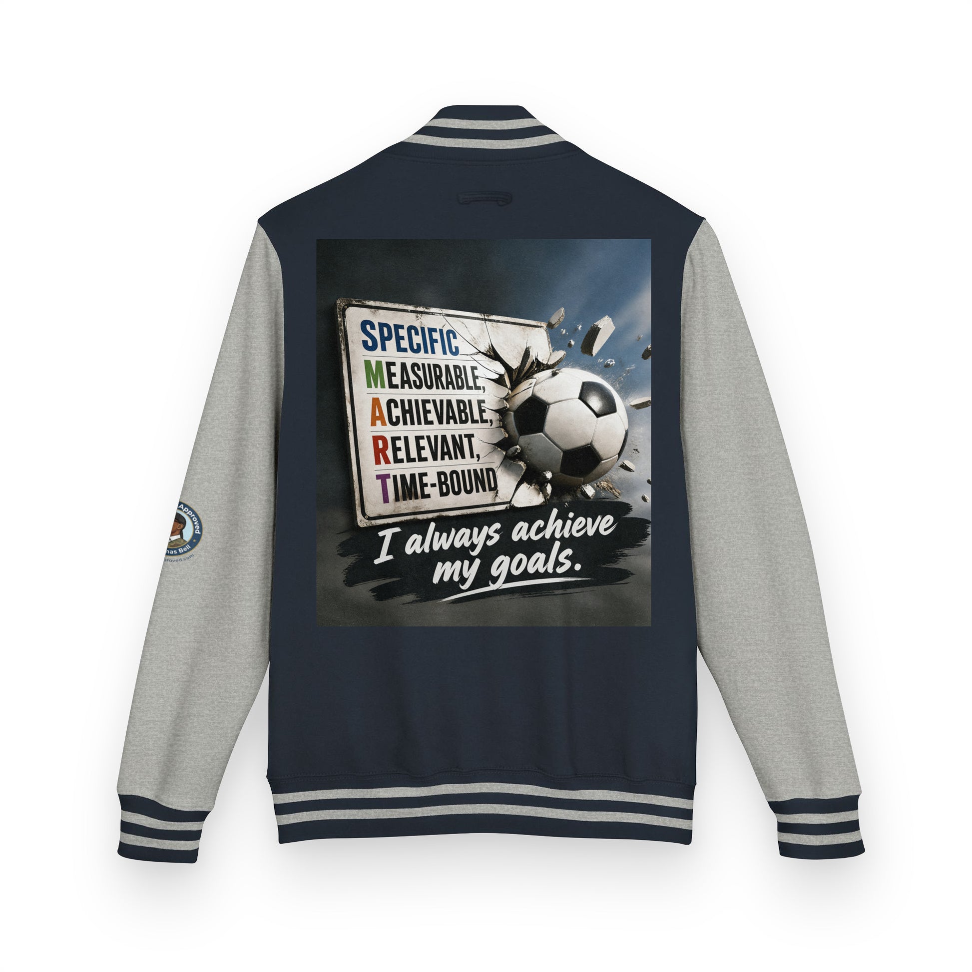Letterman jacket back view, navy body with gray sleeves; soccer graphic and quote patch