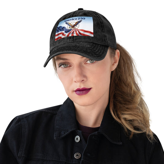 Black cap with “America 250” patch on the crown, worn by a woman