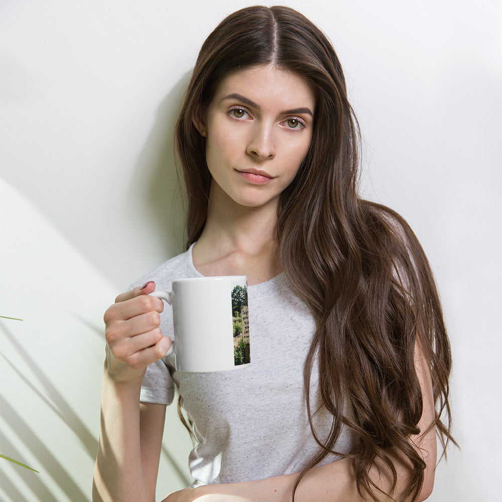 Self-love white glossy mug held in hand, front graphic visible