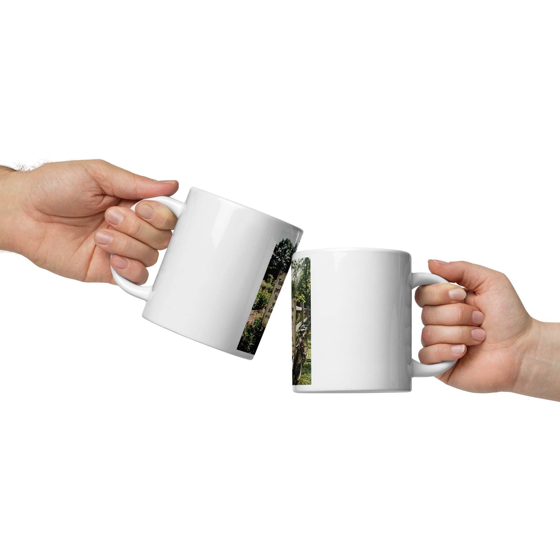 White glossy mug in hand with scenic side photo strip, curved handle and open rim