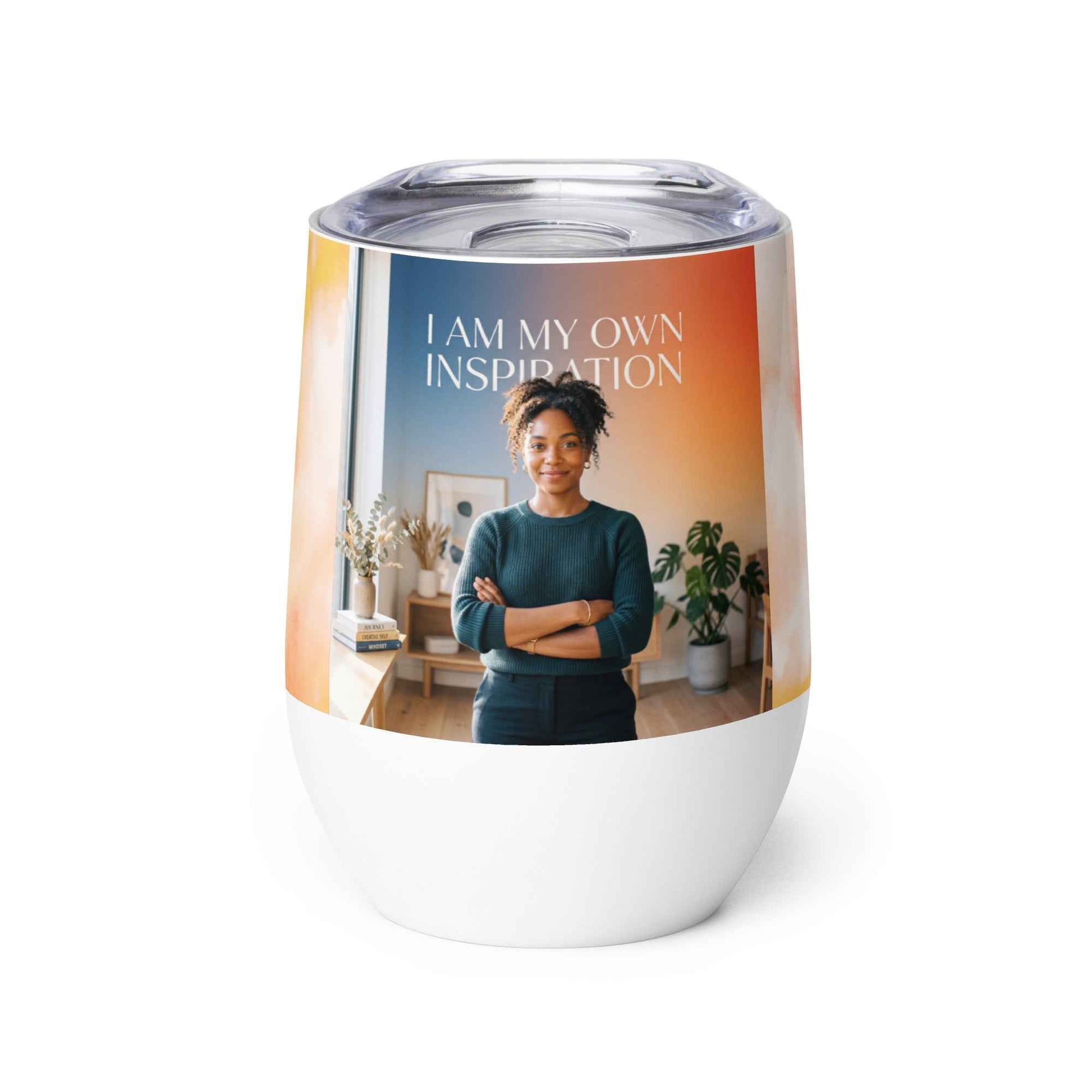 Wine tumbler with clear plastic lid, white base, and “I AM MY OWN INSPIRATION” graphic.