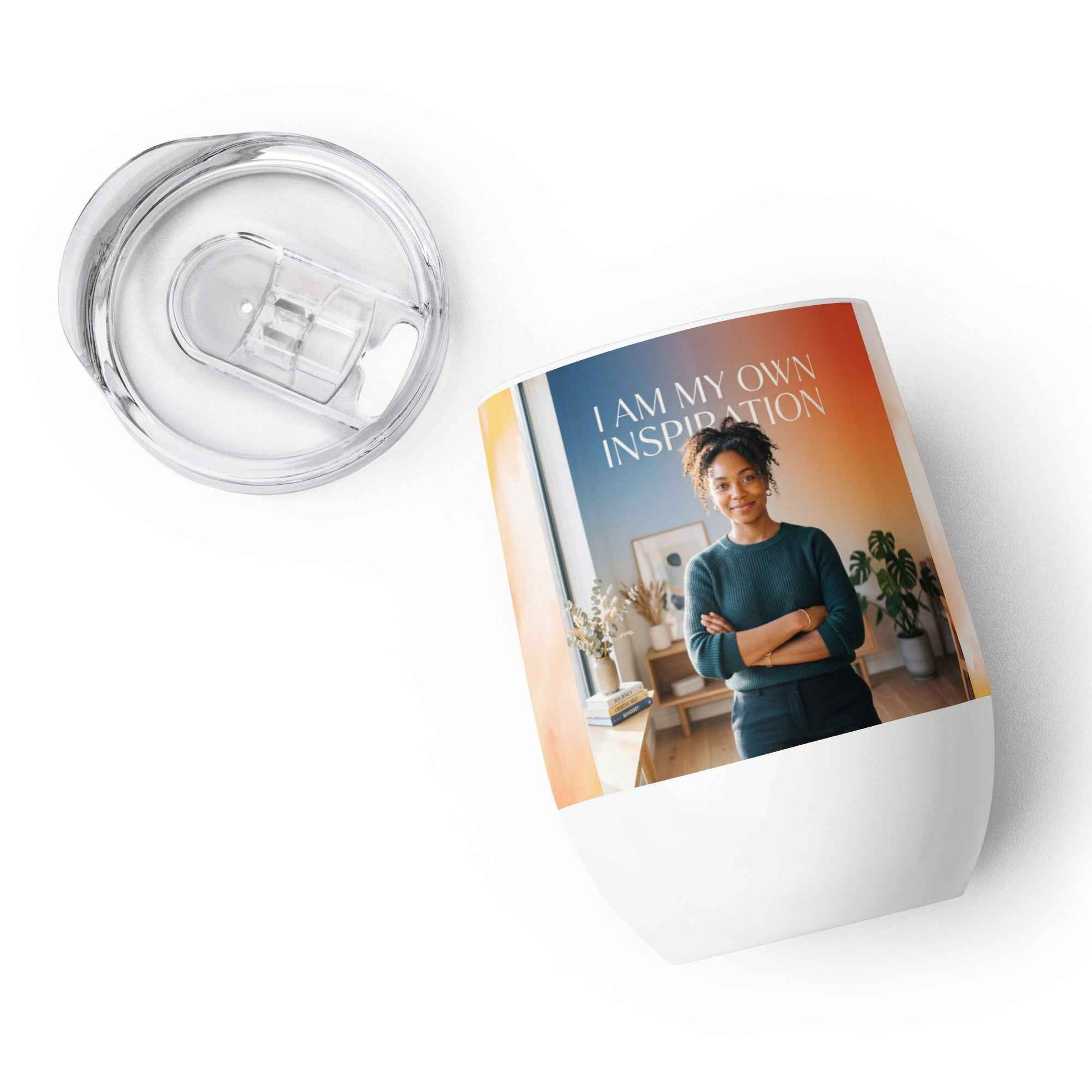 Wine tumbler with clear plastic lid and straw-style opening, white base, inspiration photo graphic.