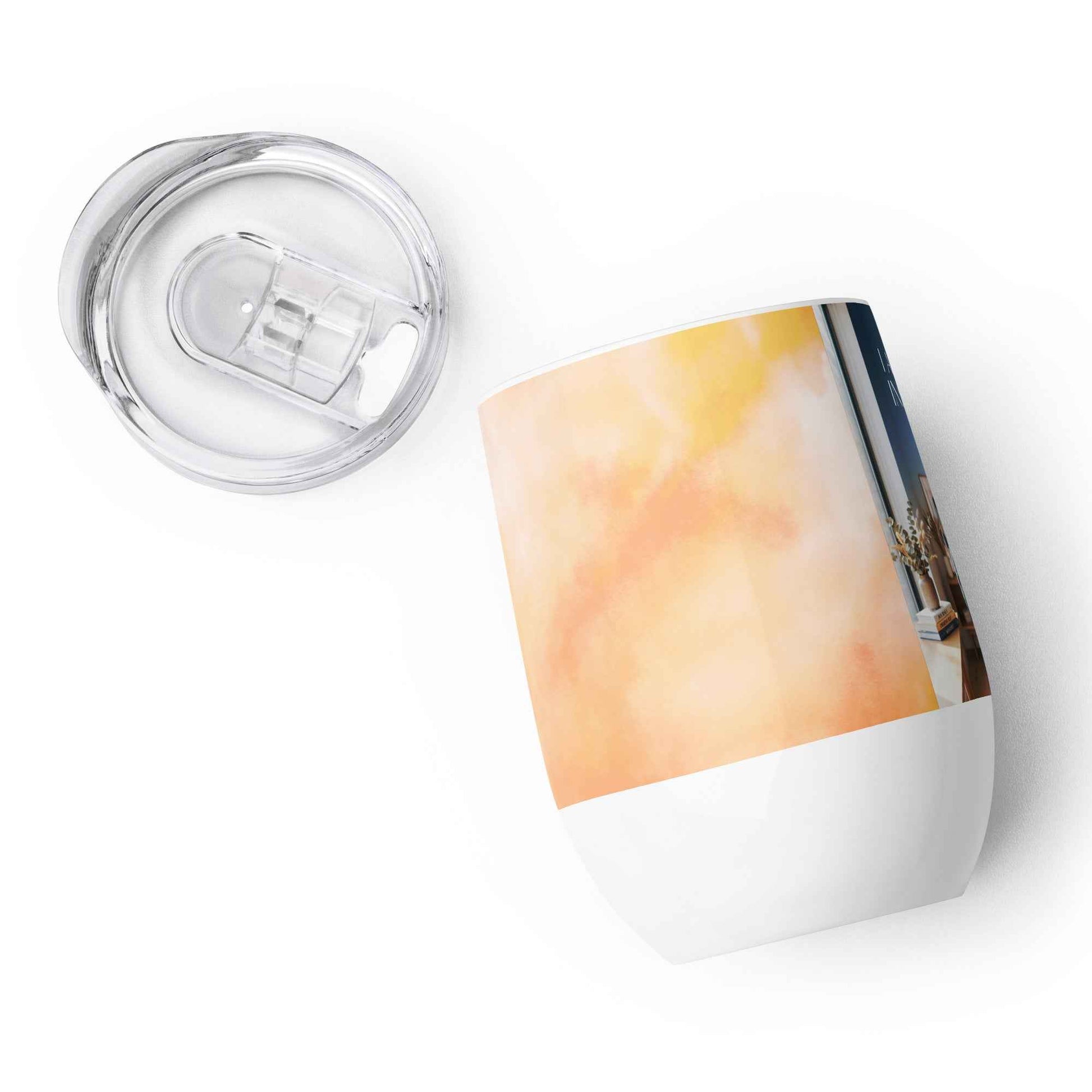 Wine tumbler with clear plastic lid, white base, and orange watercolor panel with partial photo.