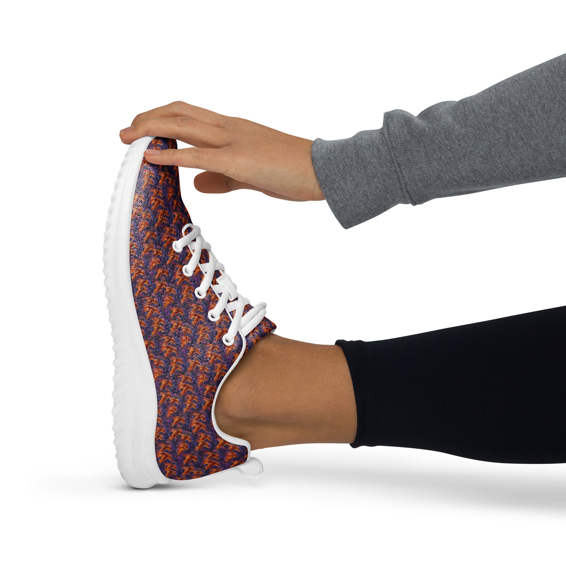 Women’s athletic shoes close-up with multicolor speckled knit upper and white lace-up