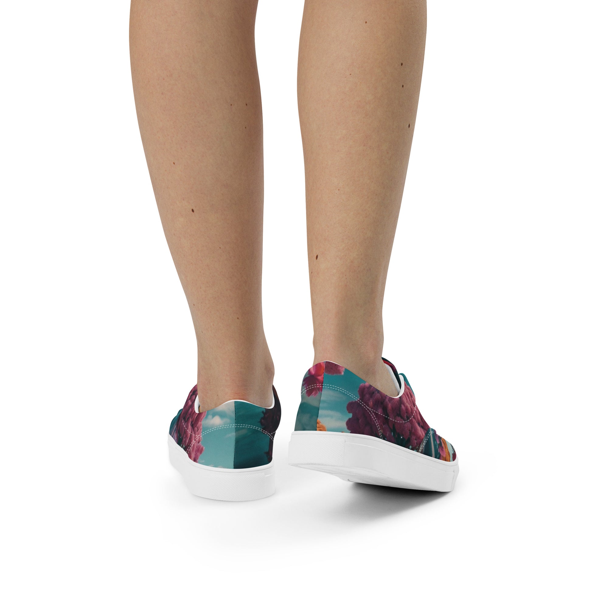 Lace-up canvas sneakers, rear view of floral uppers with white sole and heel panel