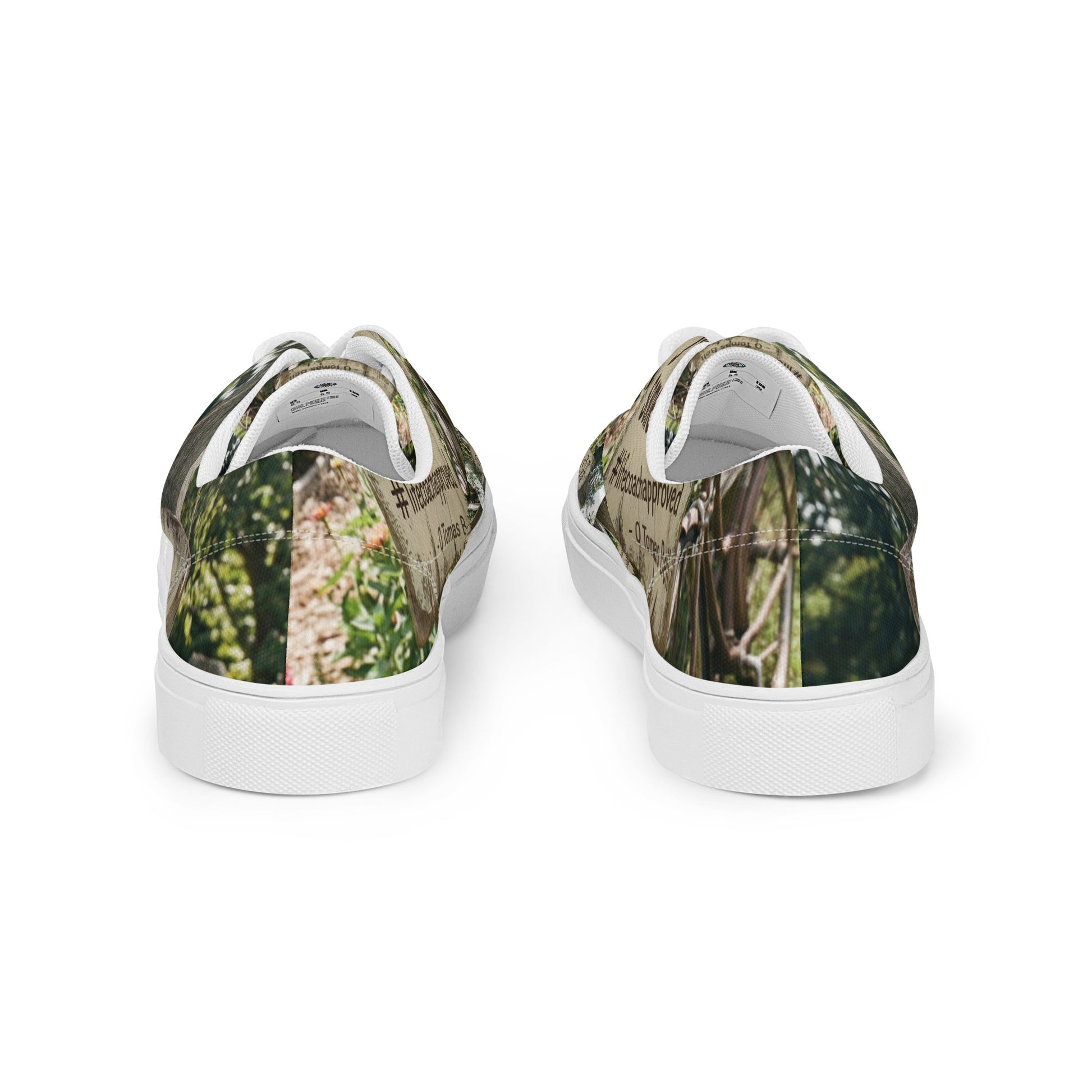 Back view of low-top canvas sneakers with woodland print and white rubber heel cup.