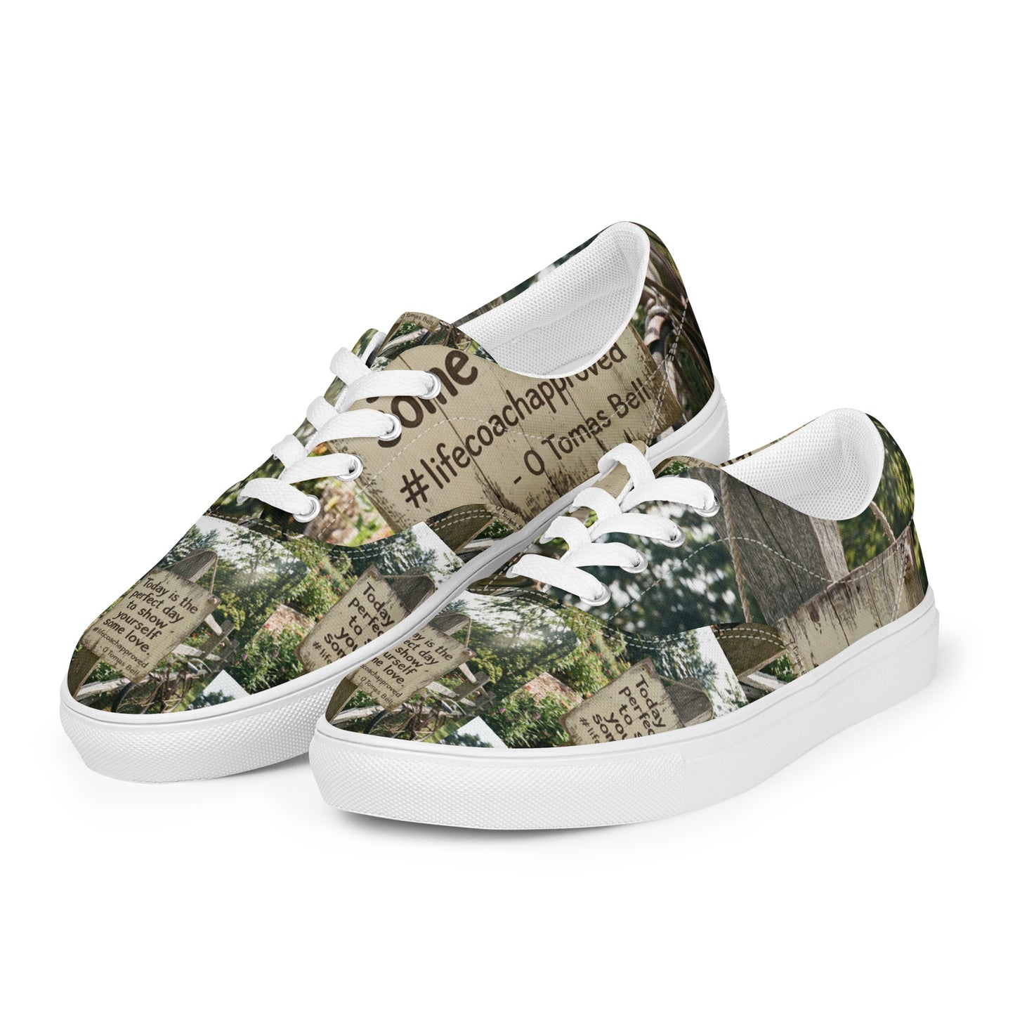 Low-top canvas sneakers with woodland print, white laces, and white toe bumper.