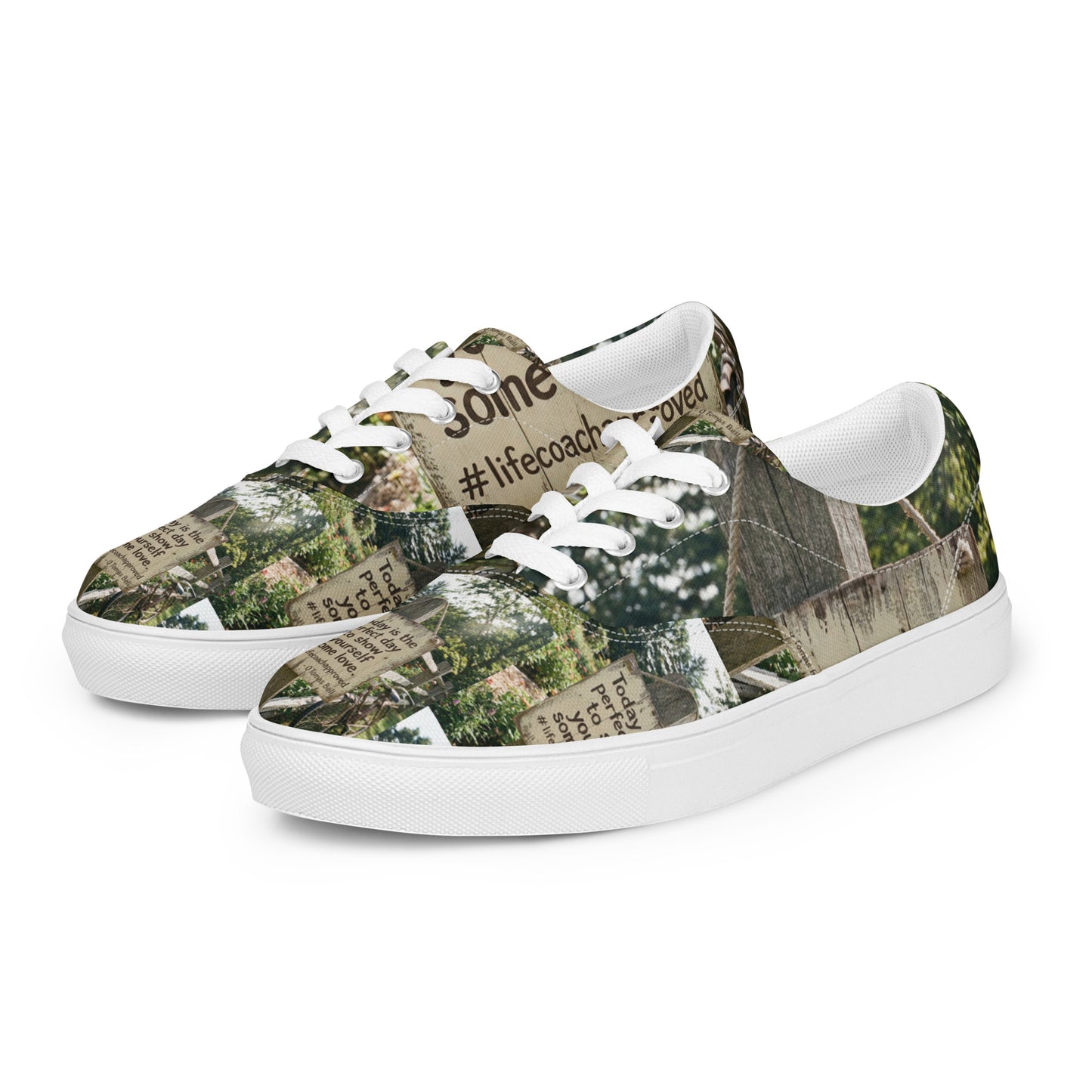 Low-top canvas sneakers with woodland print panels, white laces and wide white sole.